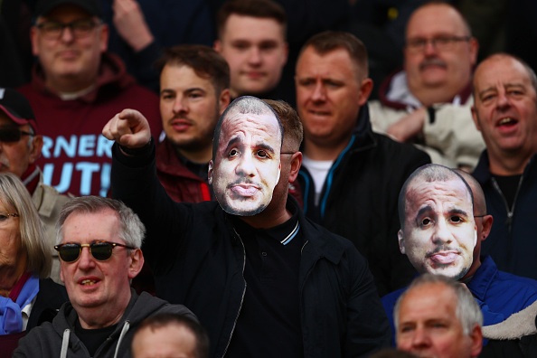 Aston Villa fans mock their player's ridiculous inability to return to full fitness. (Photo by Clive Rose/Getty Images)