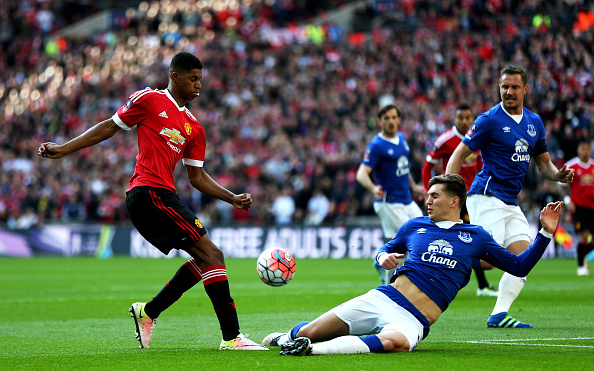 LONDON, ENGLAND - APRIL 23: Marcus Rashford of Manchester United is tackled by John Stones of Everton during the Emirates FA Cup Semi Final match between Everton and Manchester United at Wembley Stadium on April 23, 2016 in London, England. (Photo by Alex Morton - The FA/The FA via Getty Images)