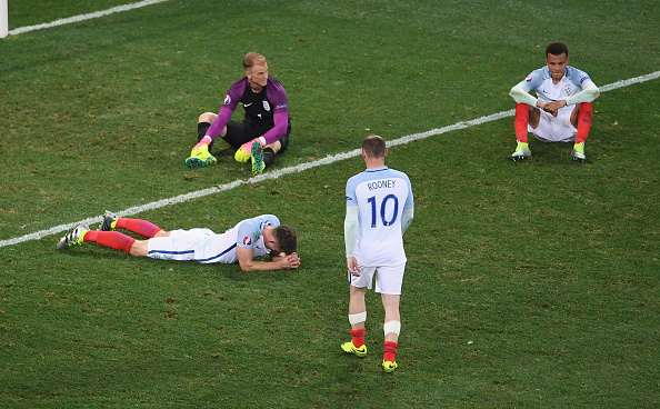 England players are distraught after their defeat against Iceland. (Photo by Laurence Griffiths/Getty Images)