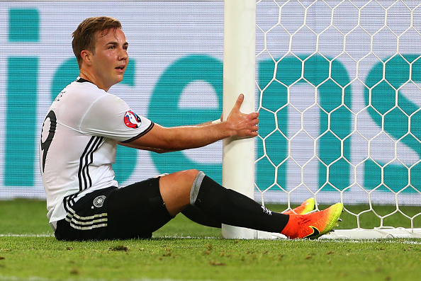 Götze sits in disappointment after missing a golden opportunity against France in EURO 2016. (Photo by Catherine Ivill - AMA/Getty Images)