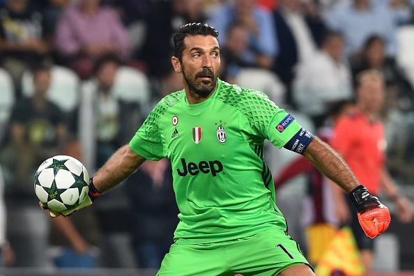 Gigi Buffon redistributes the ball during Juve's match against Sevilla in the UCL. (Photo by Giuseppe Cacace/AFP/Getty Images)