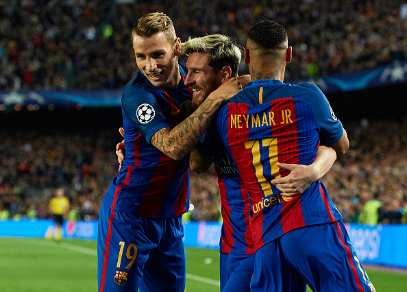 Messi celebrates his first goal with teammates. (Photo by Manuel Queimadelos Alonso/Getty Images)