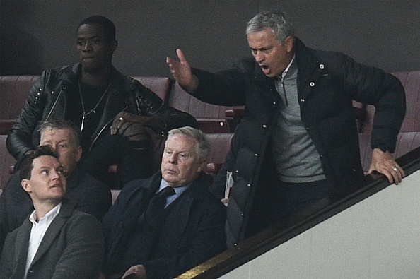 See if you can spot Mourinho. (Photo by OLI SCARFF/AFP/Getty Images)