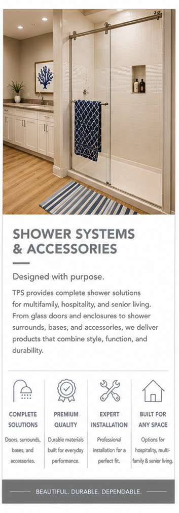 A modern bathroom with a glass shower enclosure, a striped rug, a vanity with a blue coral artwork, and a potted plant. The shower has a towel bar with a blue towel and built-in niche with bottles.