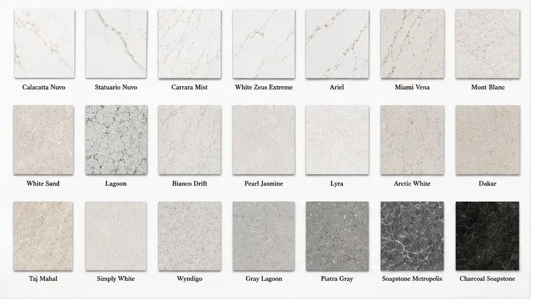 A collection of 16 marble and stone tile samples labeled with names like Calacatta Nuvo, Statuario Nuvo, Carrara Mist, White Zeus Extreme, Ariel, Miami Vena, Mont Blanc, White Sand, Lagoon, Bianco Drift, Pearl Jasmine, Lyra, Arctic White, Dakar, Taj 