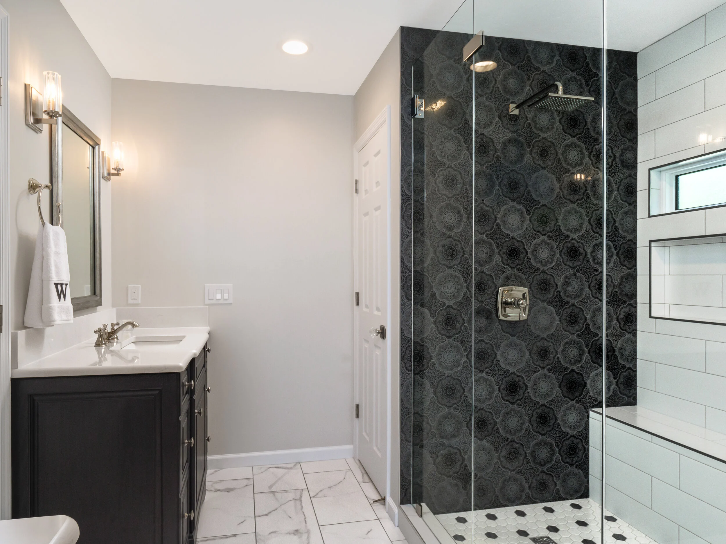 bathroom with black tile wall