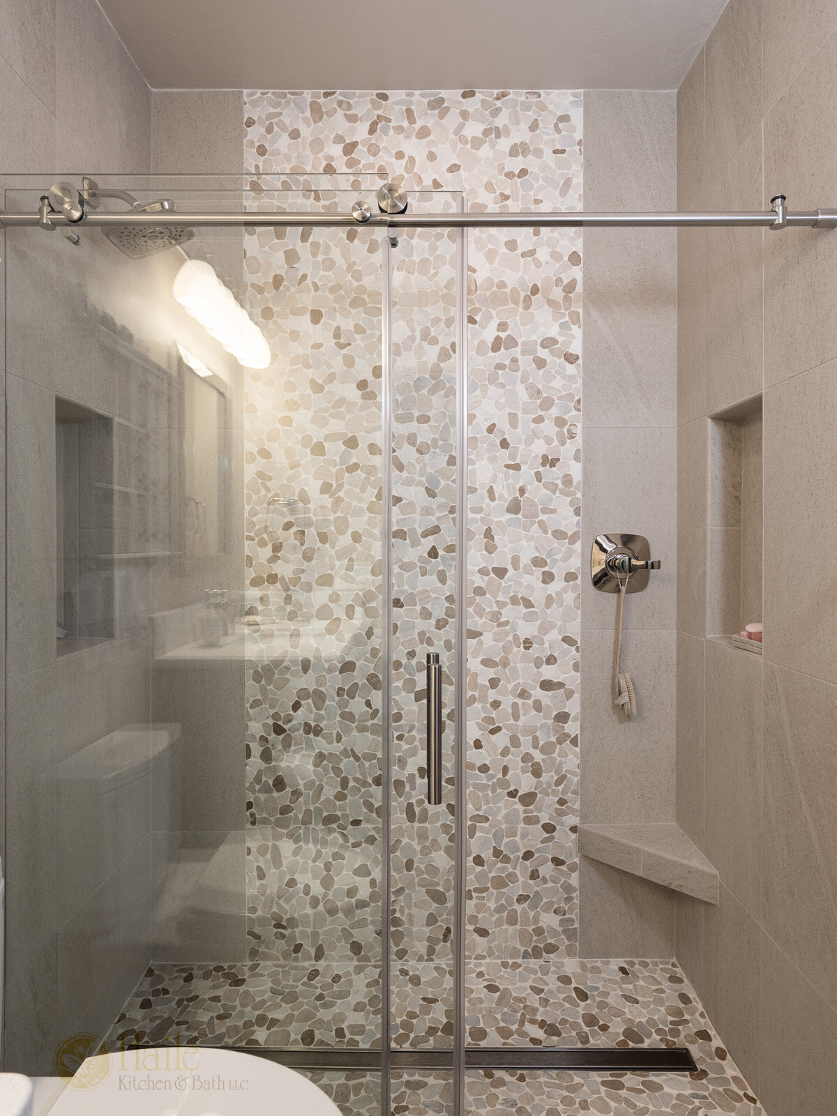 shower design with pebble tile