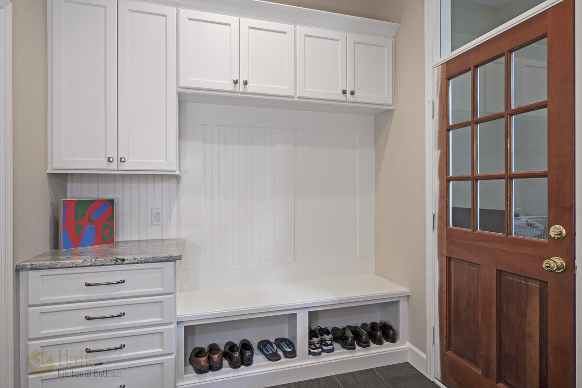 mudroom with a bench and shoe storage