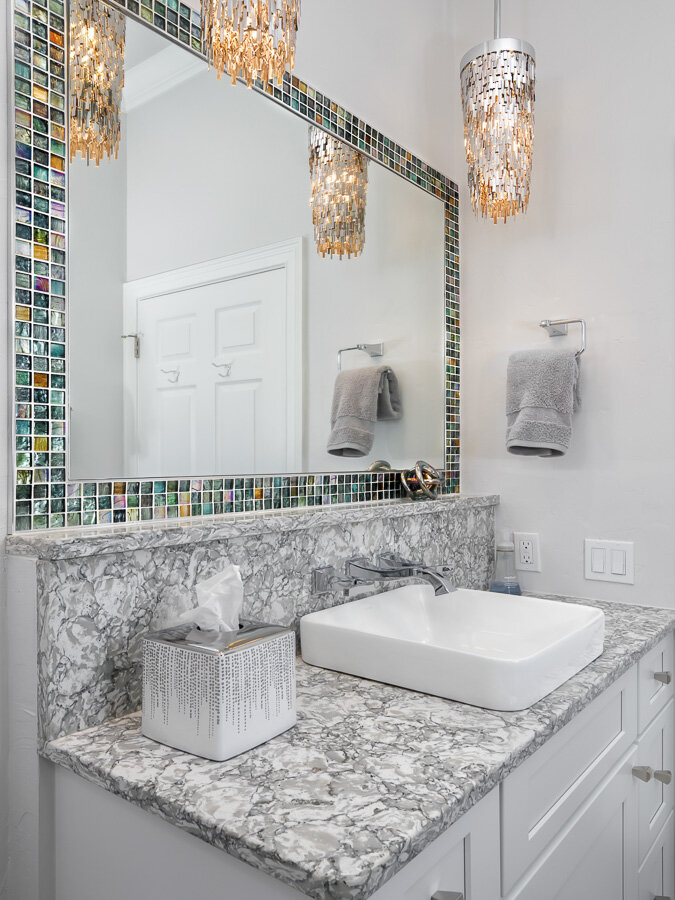 bathroom vanity and framed mirror
