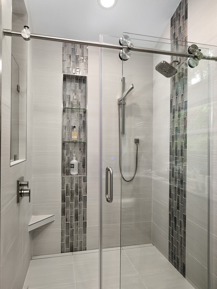shower niche with glass shelves
