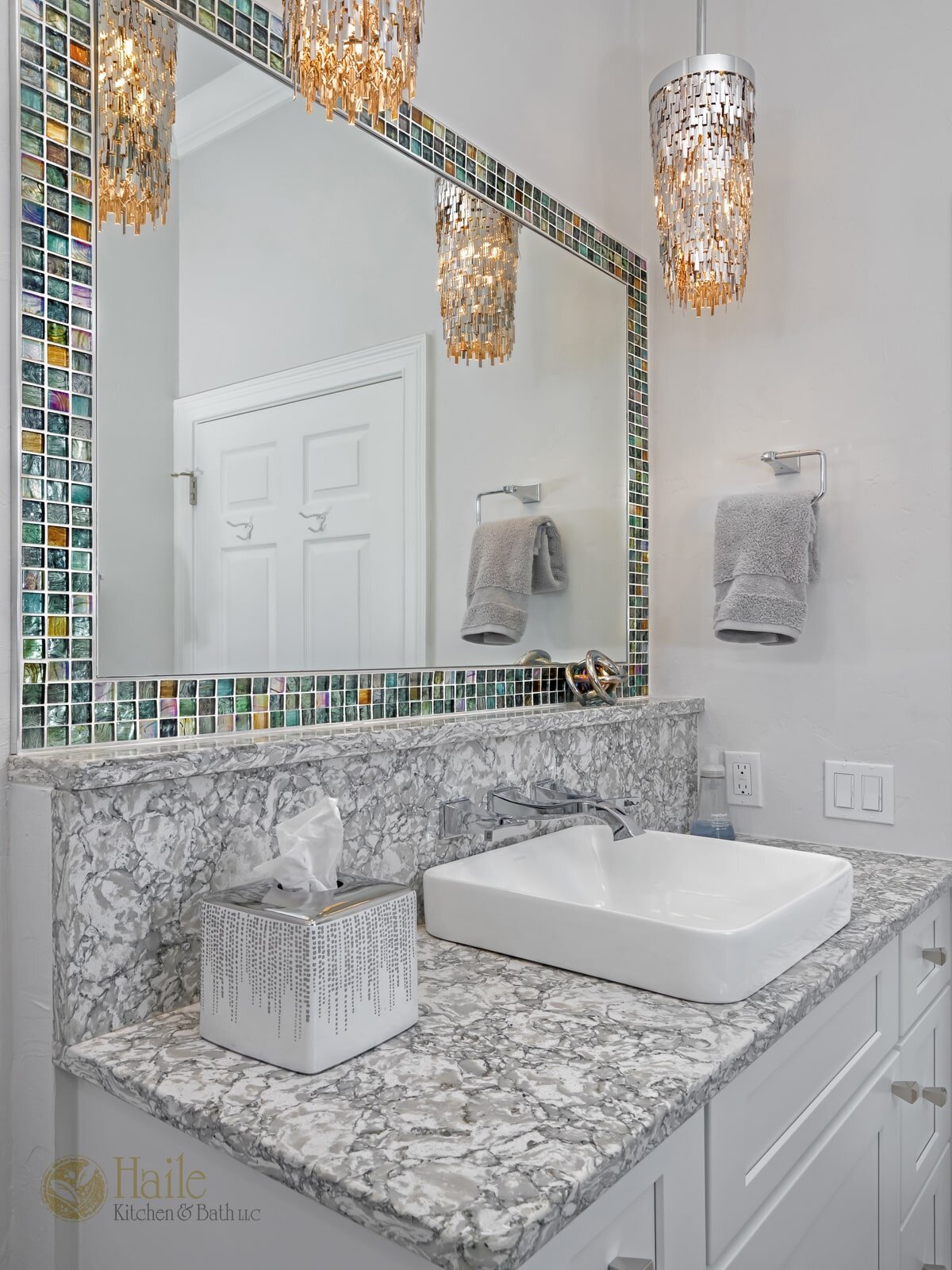 bath design with tile framed mirror
