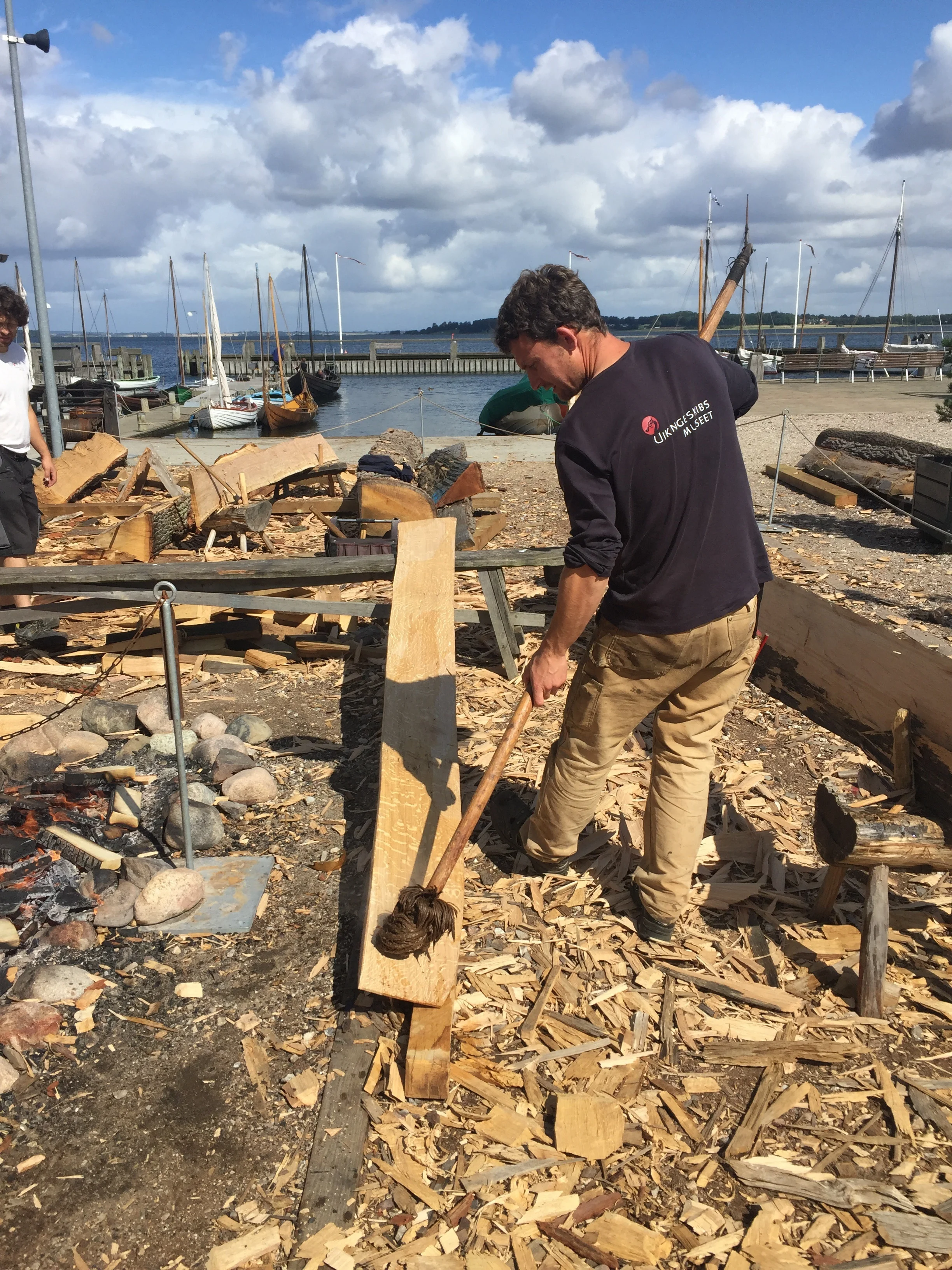 Here's Martin wetting out the plank before he puts Its on the fire. Just a good idea to start.