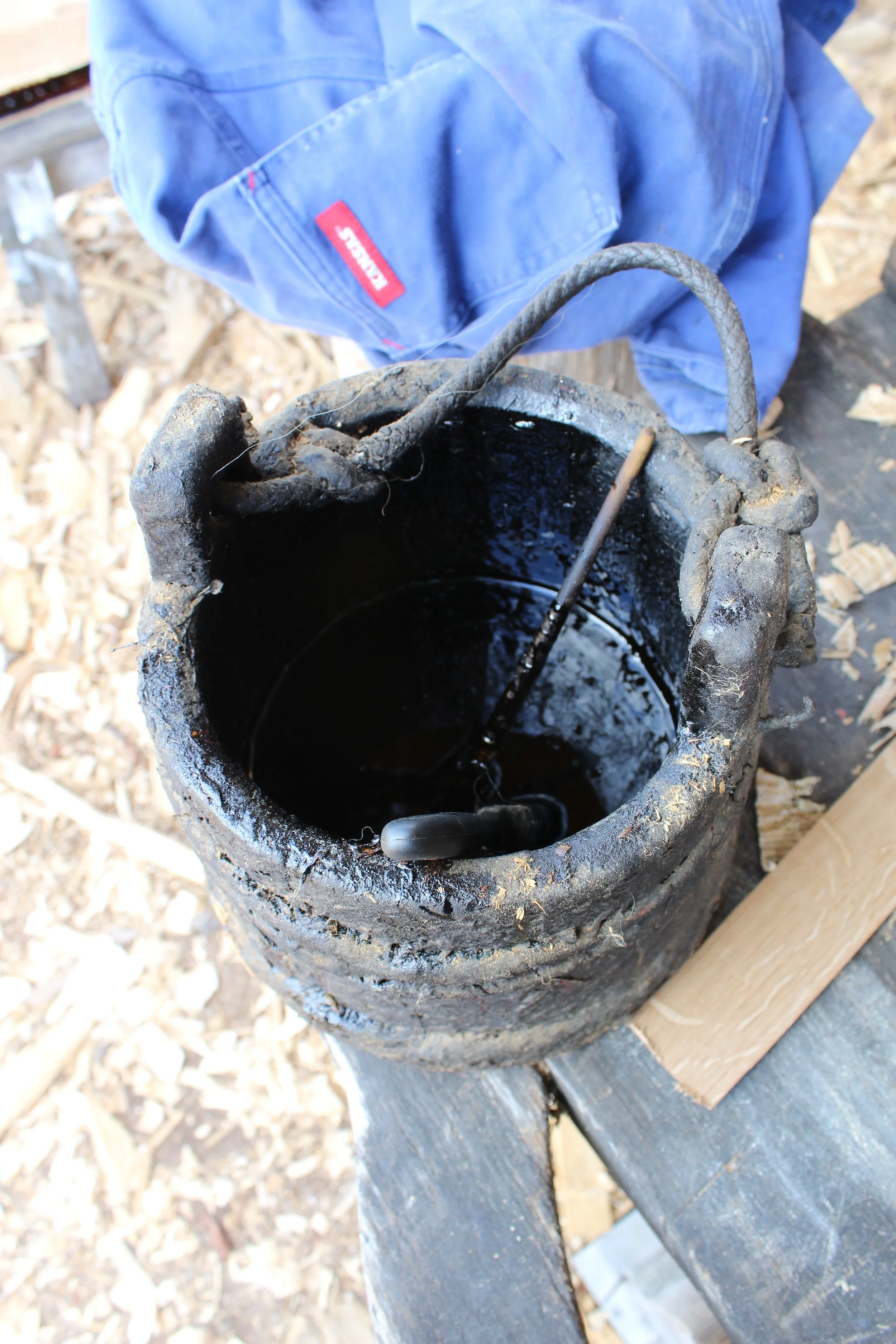 Bucket of pine tar.