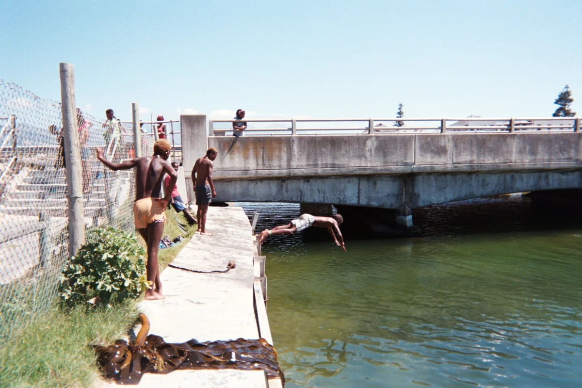 Right next to a water park on the beach, these local boys instead enjoying this canal