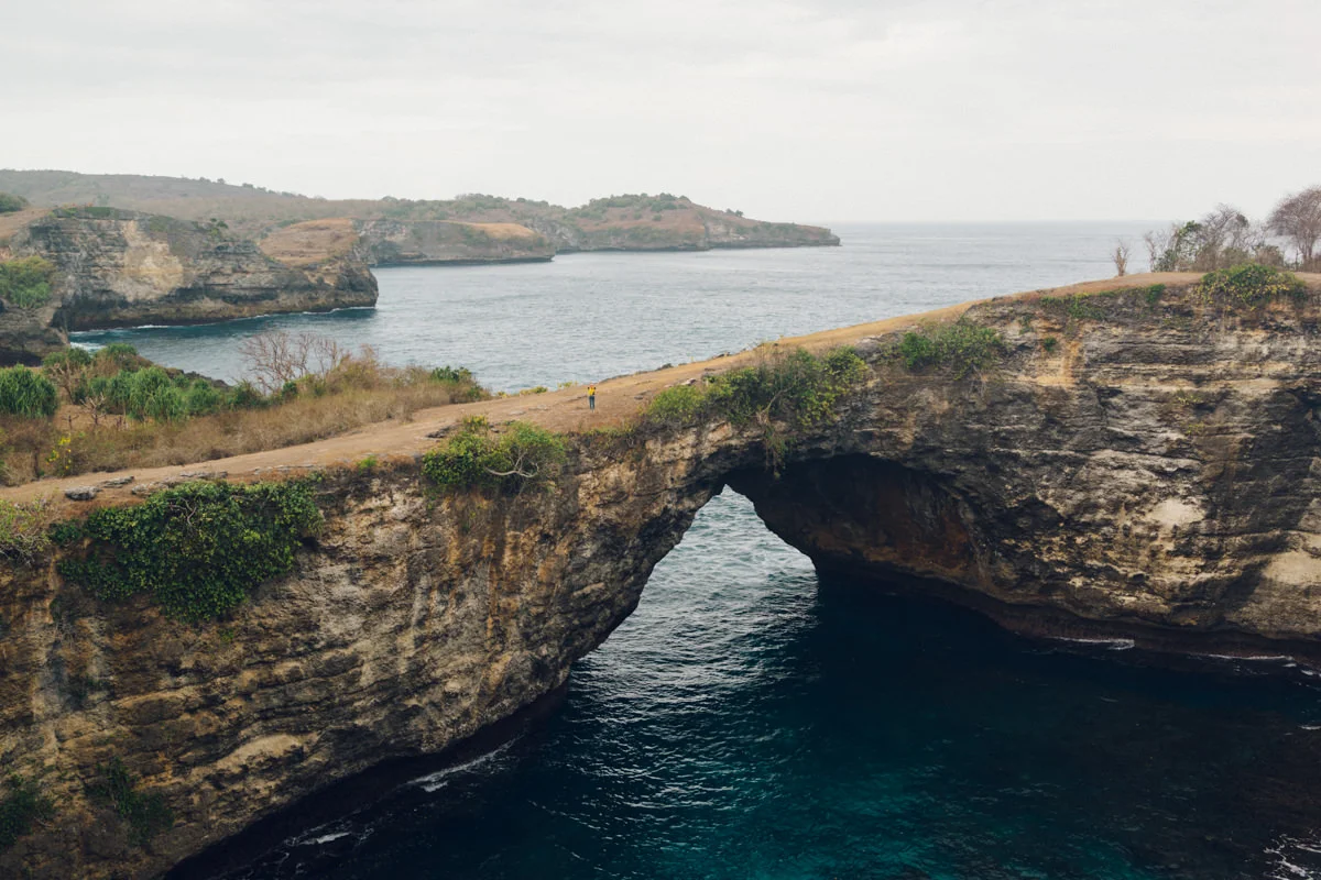 Sea Crater, a circular lagoon surrounded by steep cliffs with a natural bridge over the inlet from the sea