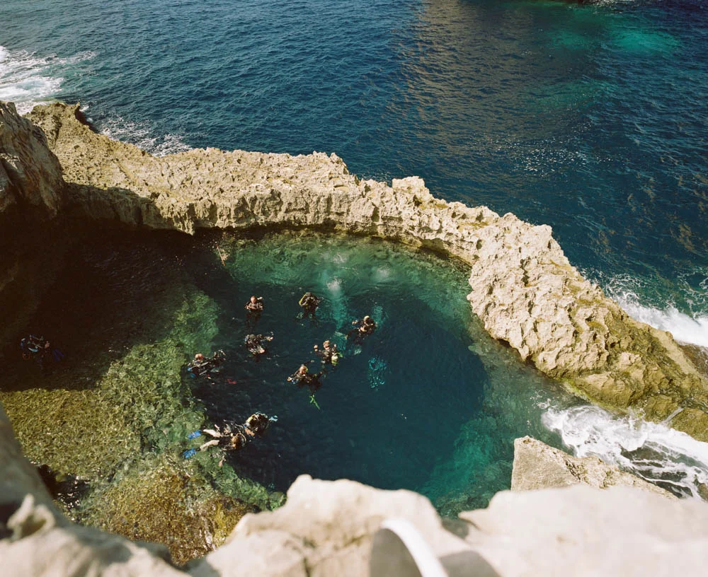 Gozo’s world famous dive site, the Blue Hole. You can either start or end your dive through this hole to the sea.