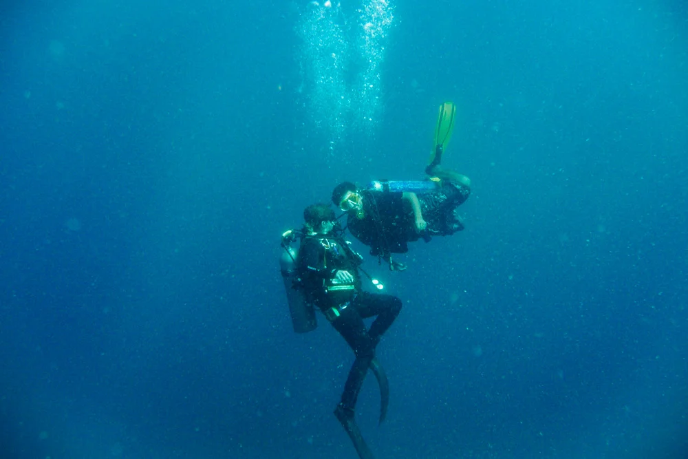 Jason buddy breathing with Dino. Apparently buddy breathing outside of emergency situations is frowned upon, but it seems to be acceptable in the Philippines. Jason went through air much faster than Dino and I did, so Dino shared his air with him on the way up so we wouldn’t have to rush.