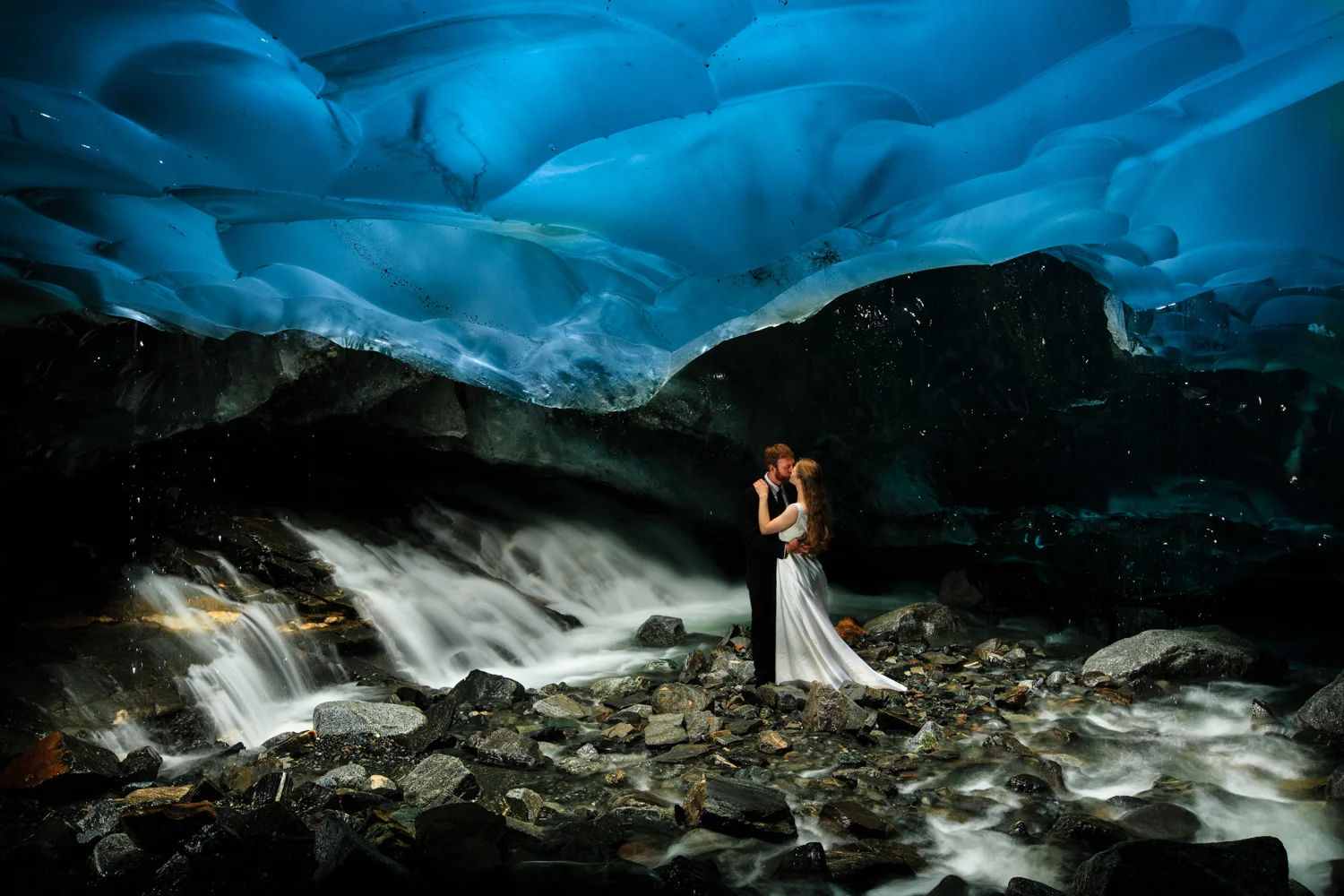Bride and Groom Inside Ice Cave in Alaska
