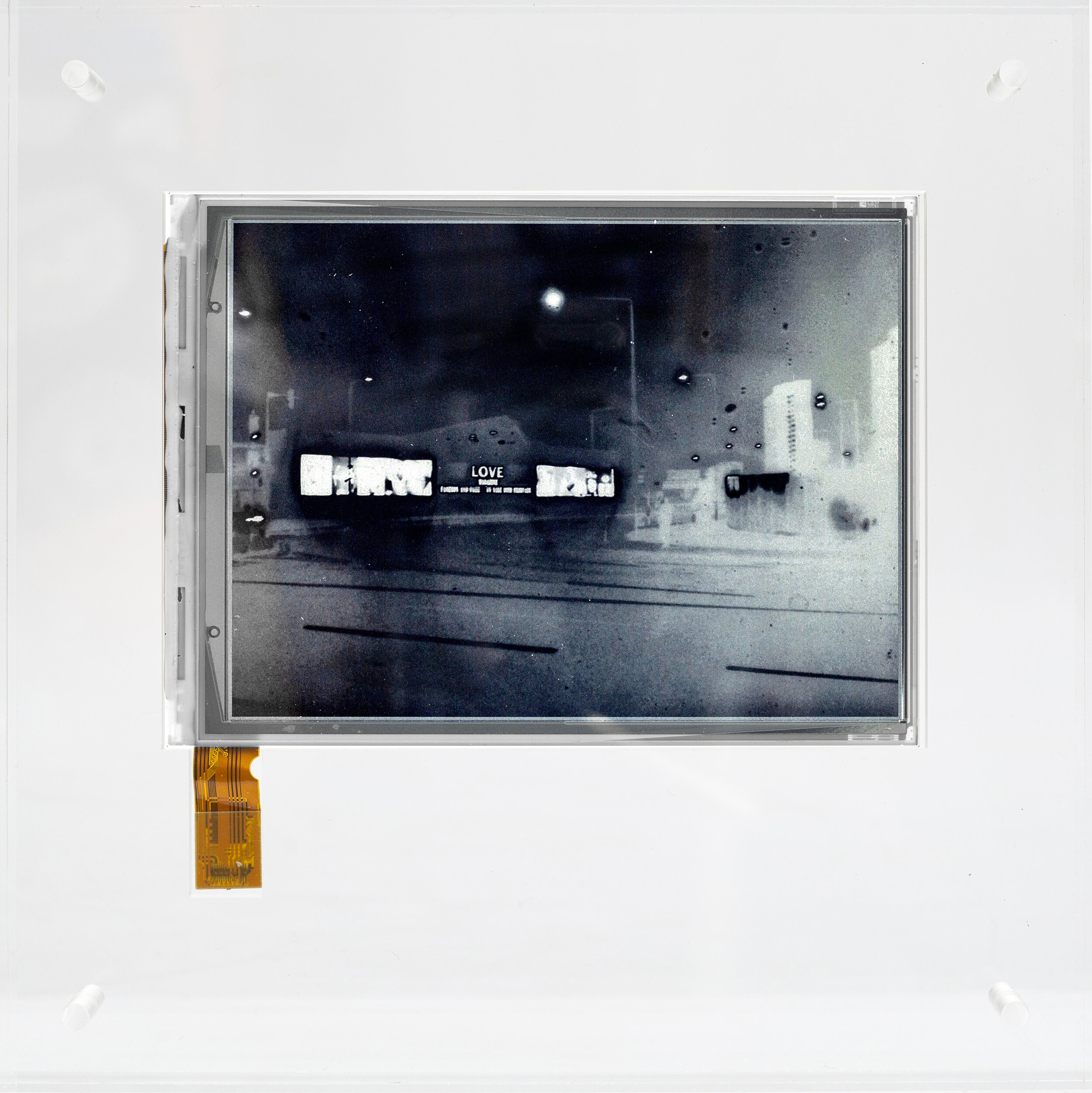 E.I. LDN025 2011 E-ink screen encapsulated in Perpex box. Negative Date 2019 10.1cm 12.9cm - 20 x 20 x 3.2cm with frame Unique.jpg