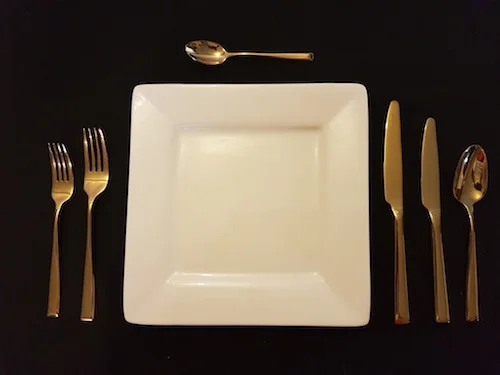 gold cutlery table setting