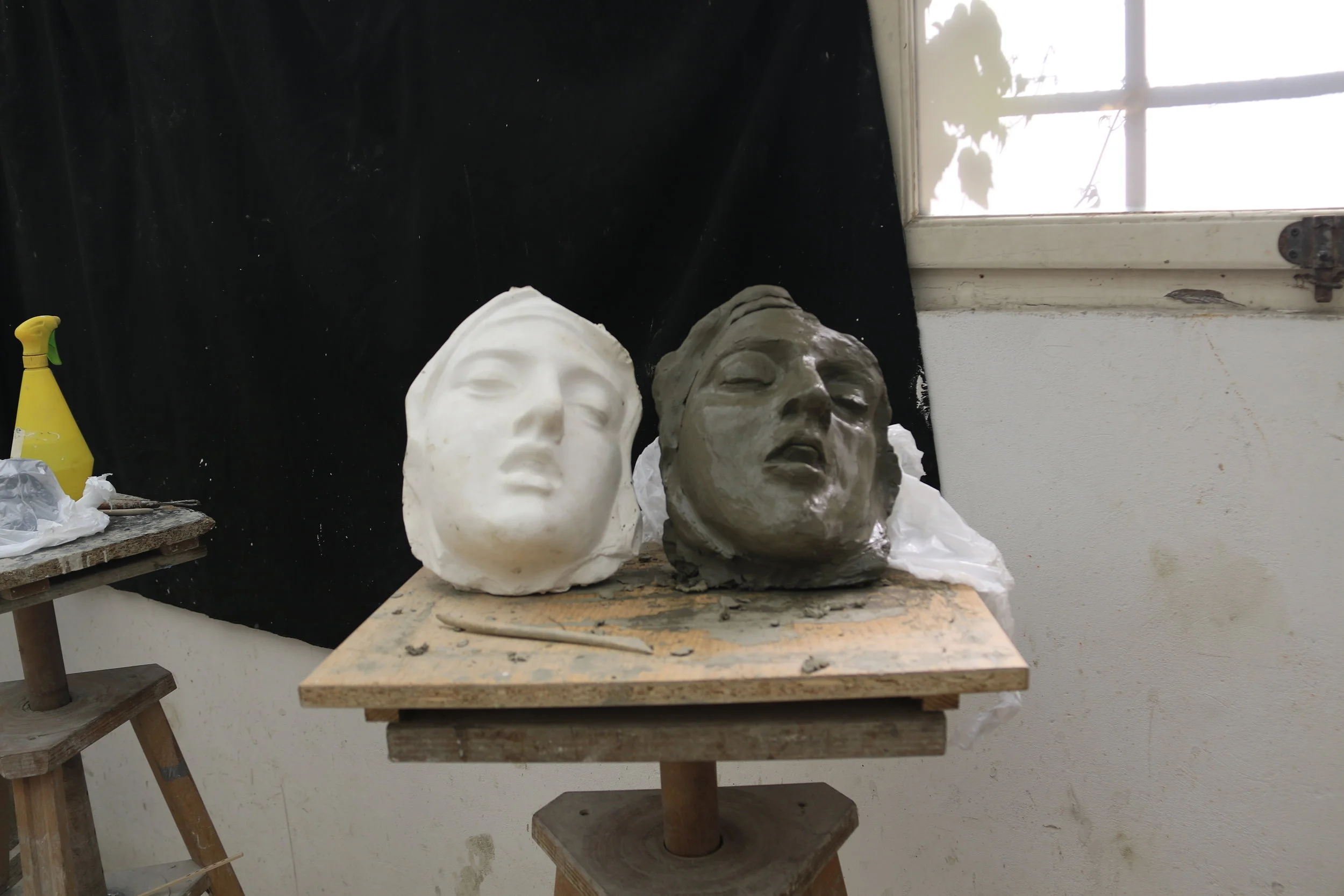 Because I started the base of the sculpture with left over softer clay, the sculpture would start to lean backwards as I was building up the mass. This would continue until I built up a large support to the back of the sculpture.