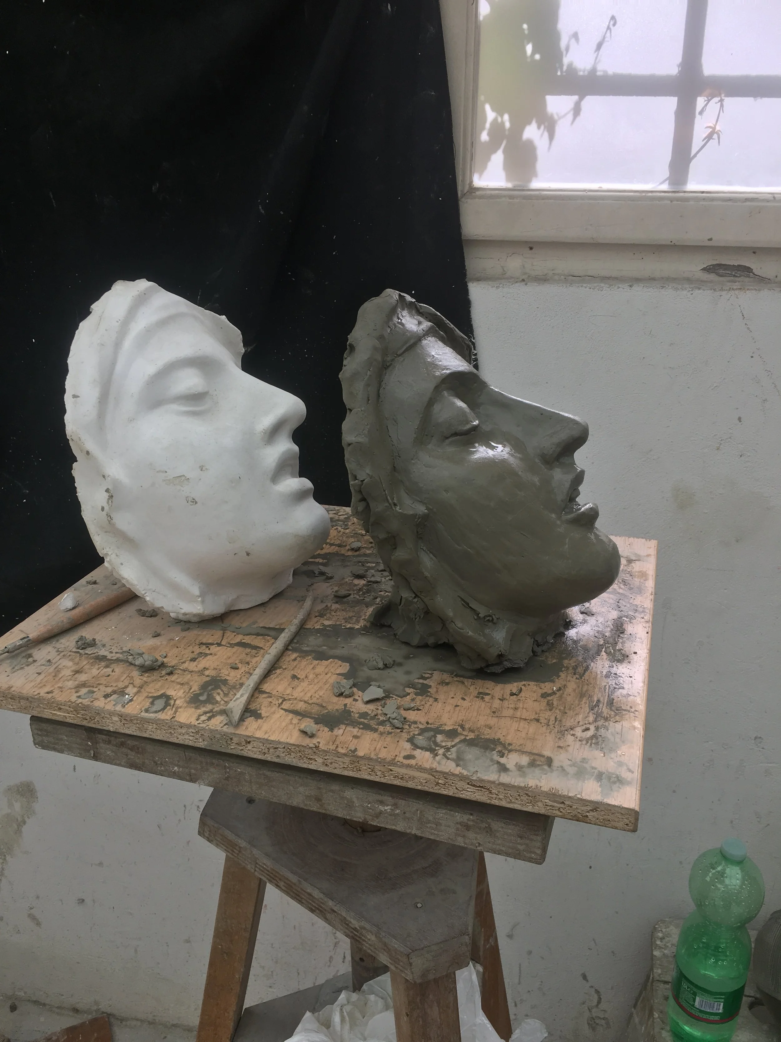 Here the rearward lean of the sculpture became evident. The new clay with grit hardened much quicker than the older smooth clay so I would build up clay over the present features to fix the angle.