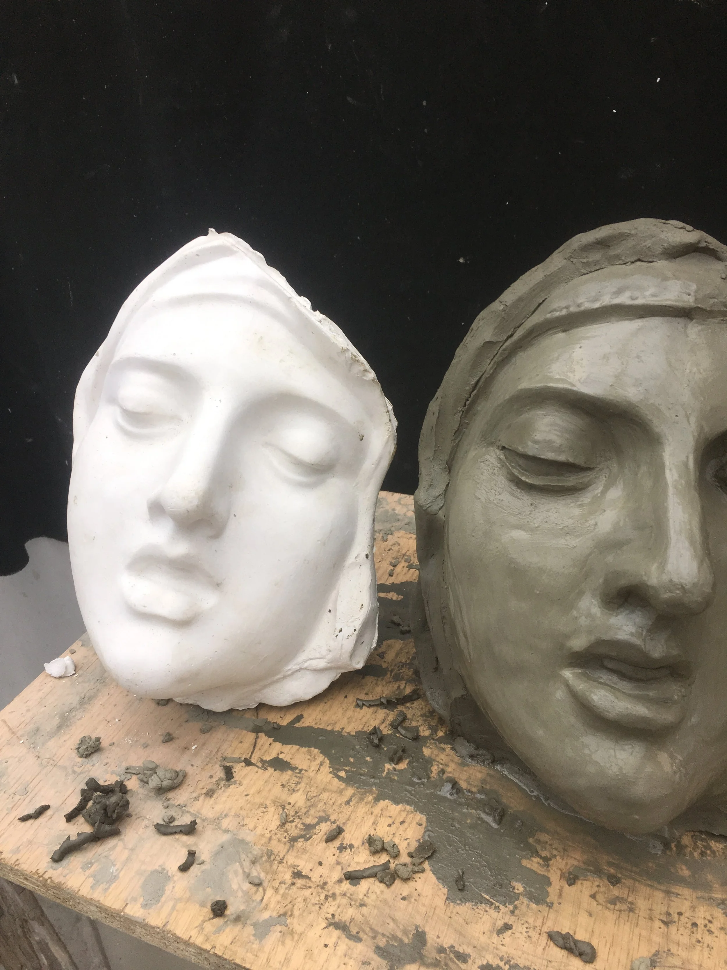 Here I have fixed the eyes, and work on correcting the angle of the nose and filling out the cheeks. The sculpture was gradually slipping to the right as the soft clay in the base compressed. This would throw off my measurements later.