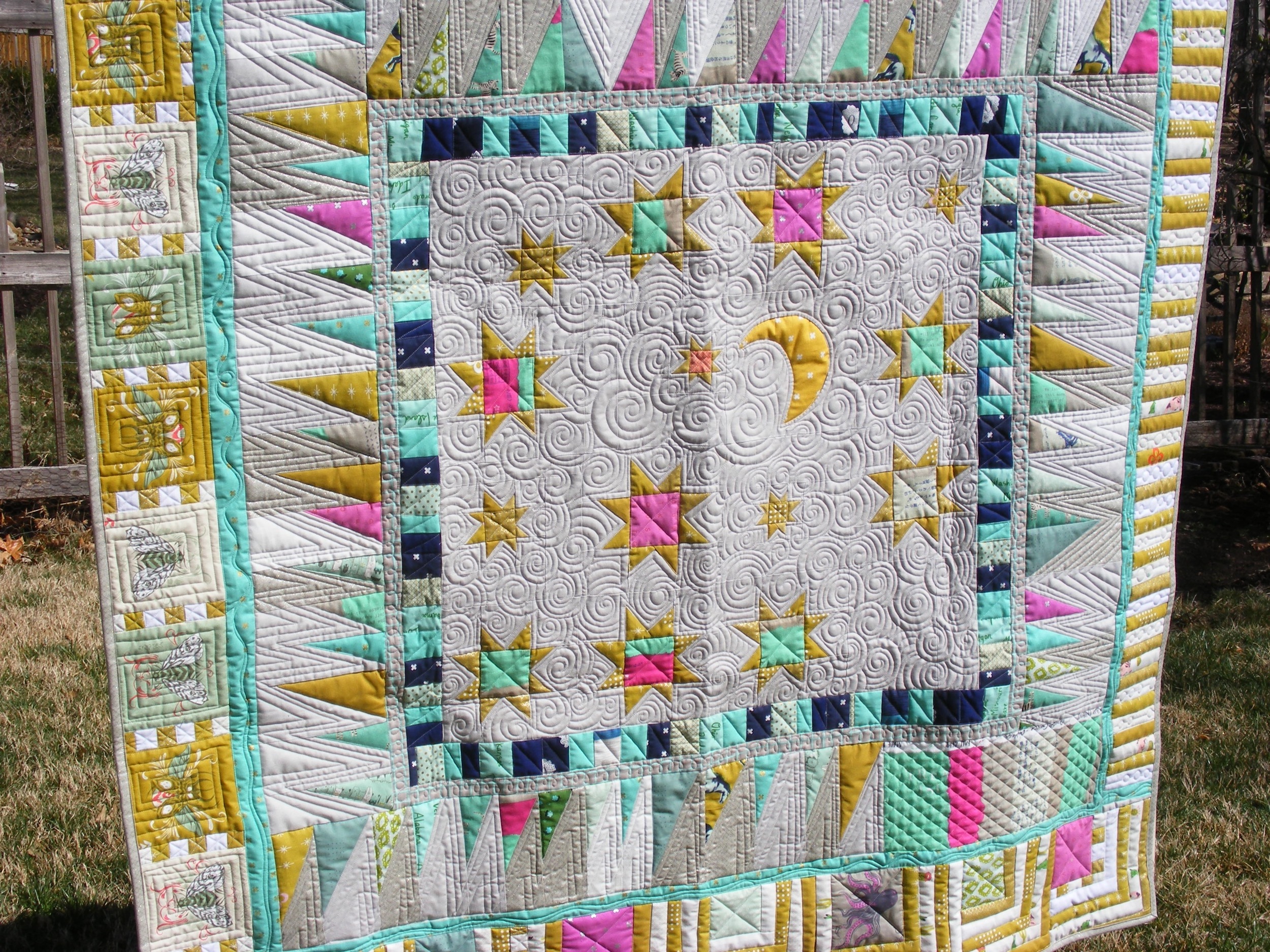 Scrappy Improv quilt made by Tia Curtis and quilted on her longarm.