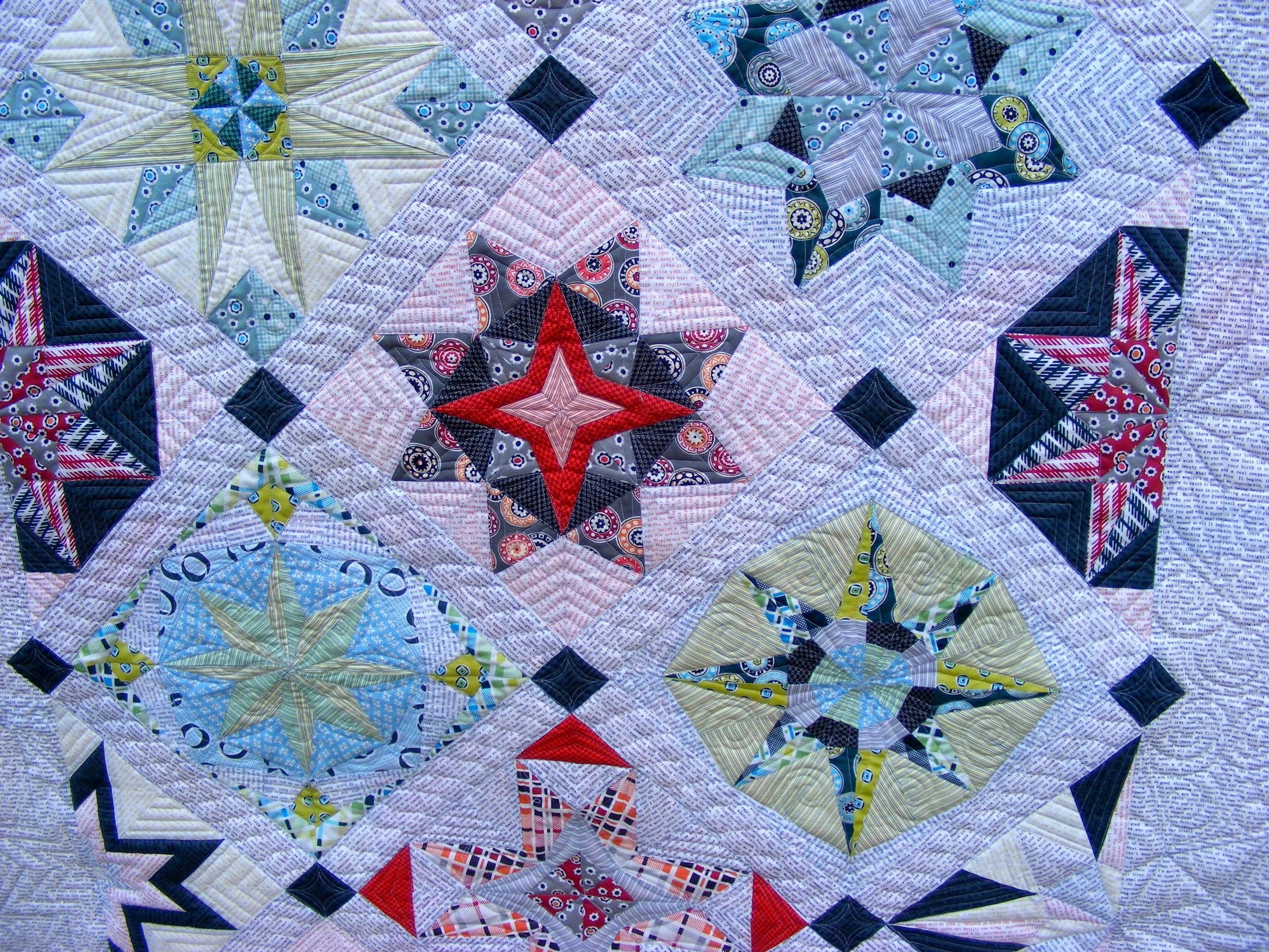 Colorful quilt with geometric star patterns
