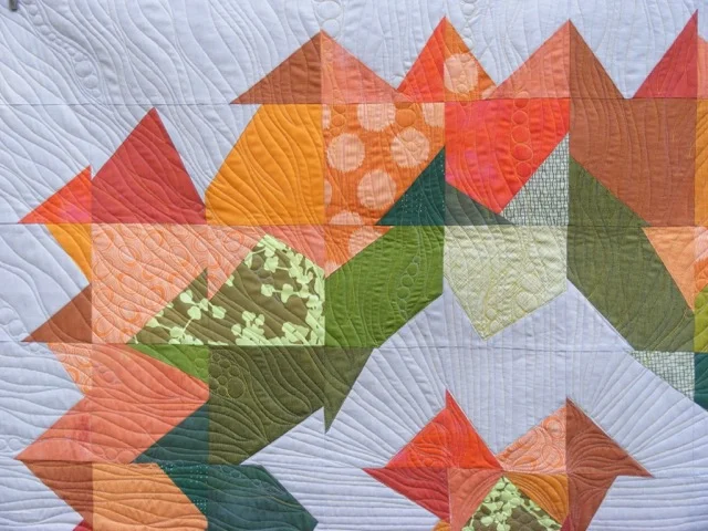 Patchwork quilt with colorful geometric shapes