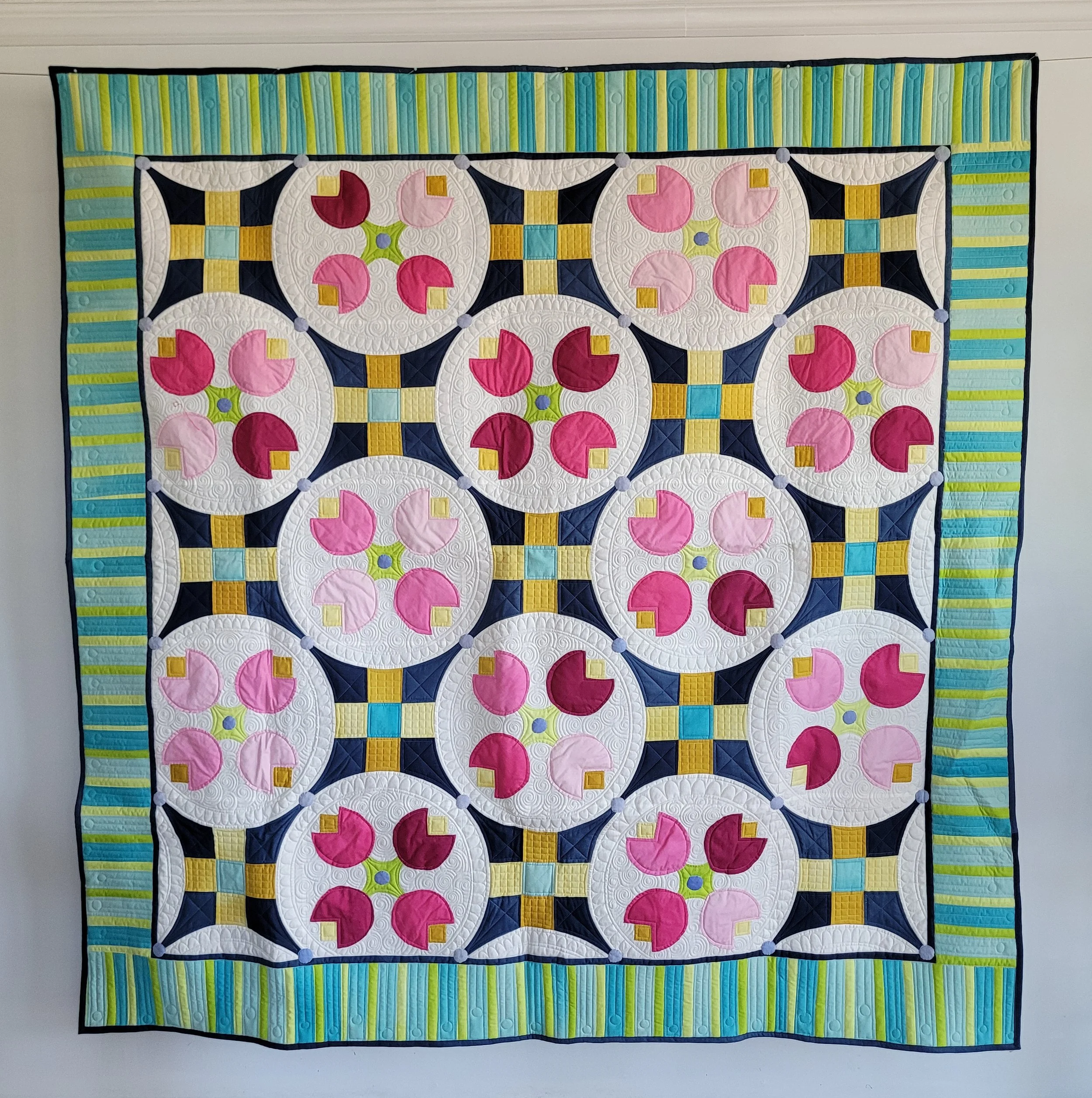 Tia's Tulips #2 made by Tia Curtis. I made this version of the quilt with Ombre fabric by Melodie Miller. It will be a quilt pattern soon