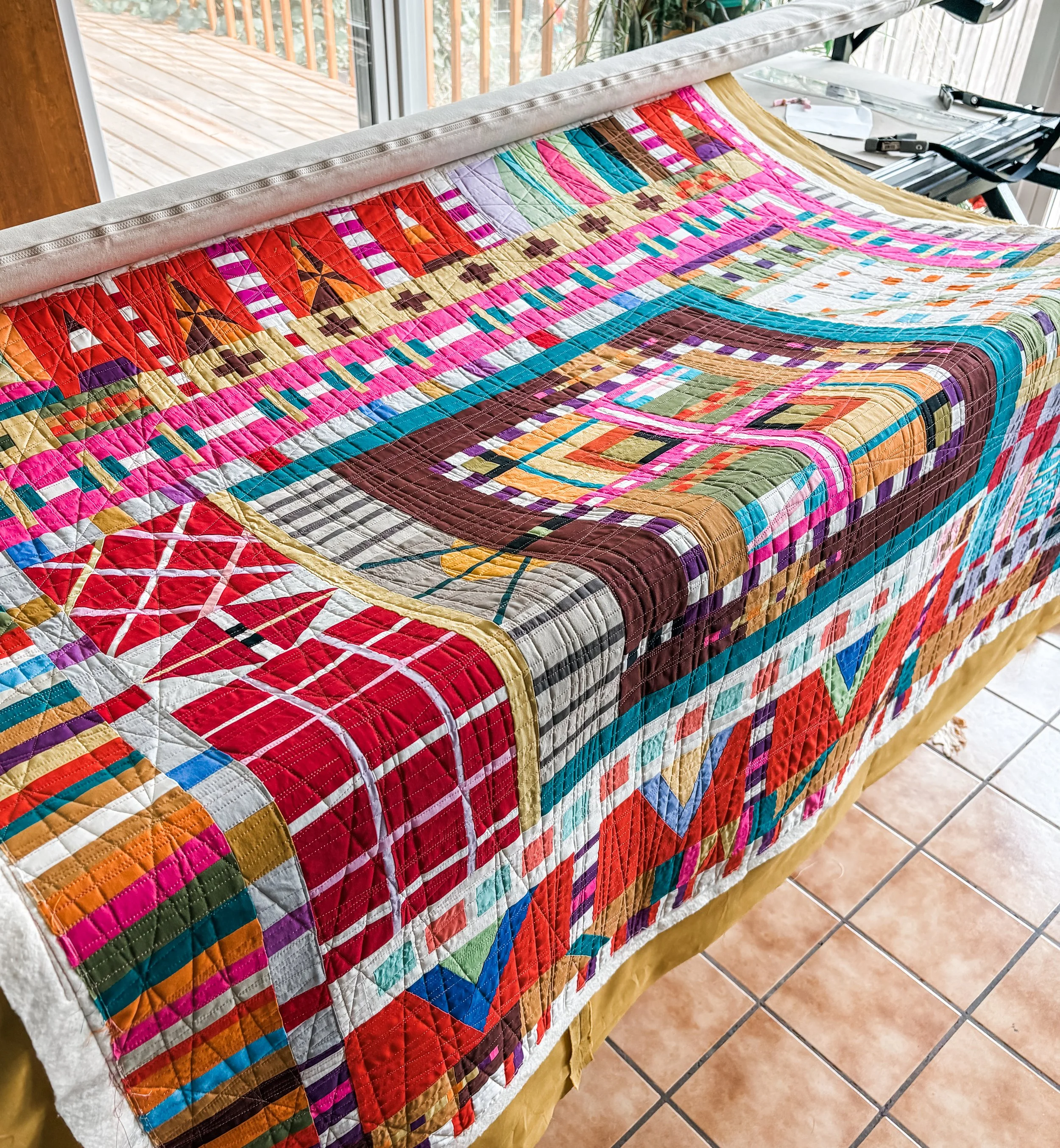 Improv Quilt Made by Tina and Custom Quilted by Tia Curtis