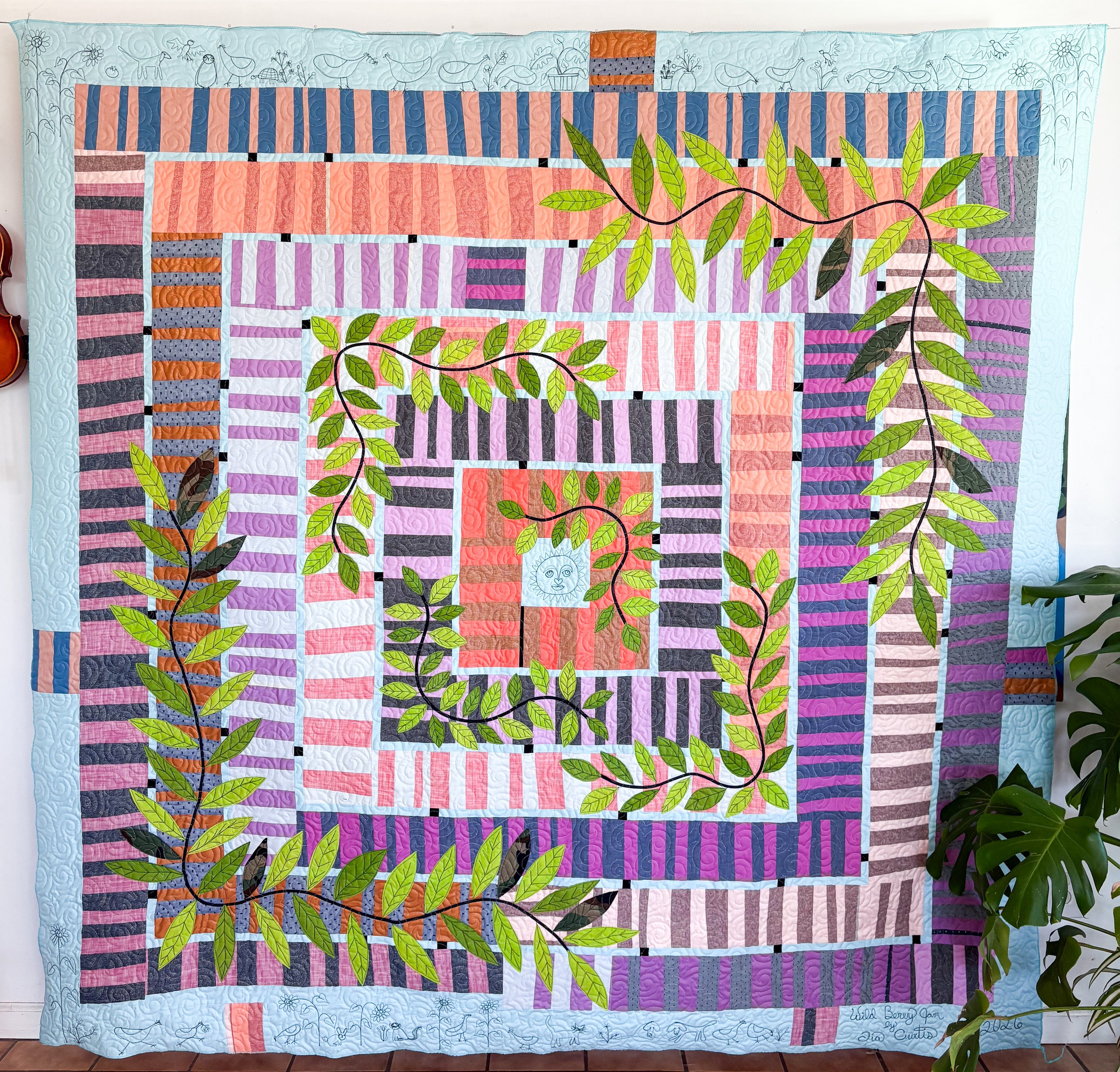 Wild Berry Jam made by Tia Curtis. I wanted to add applique to this berry Jam quilt and I also wanted to add little illustrations when I had the quilt loaded up onto my longarm.