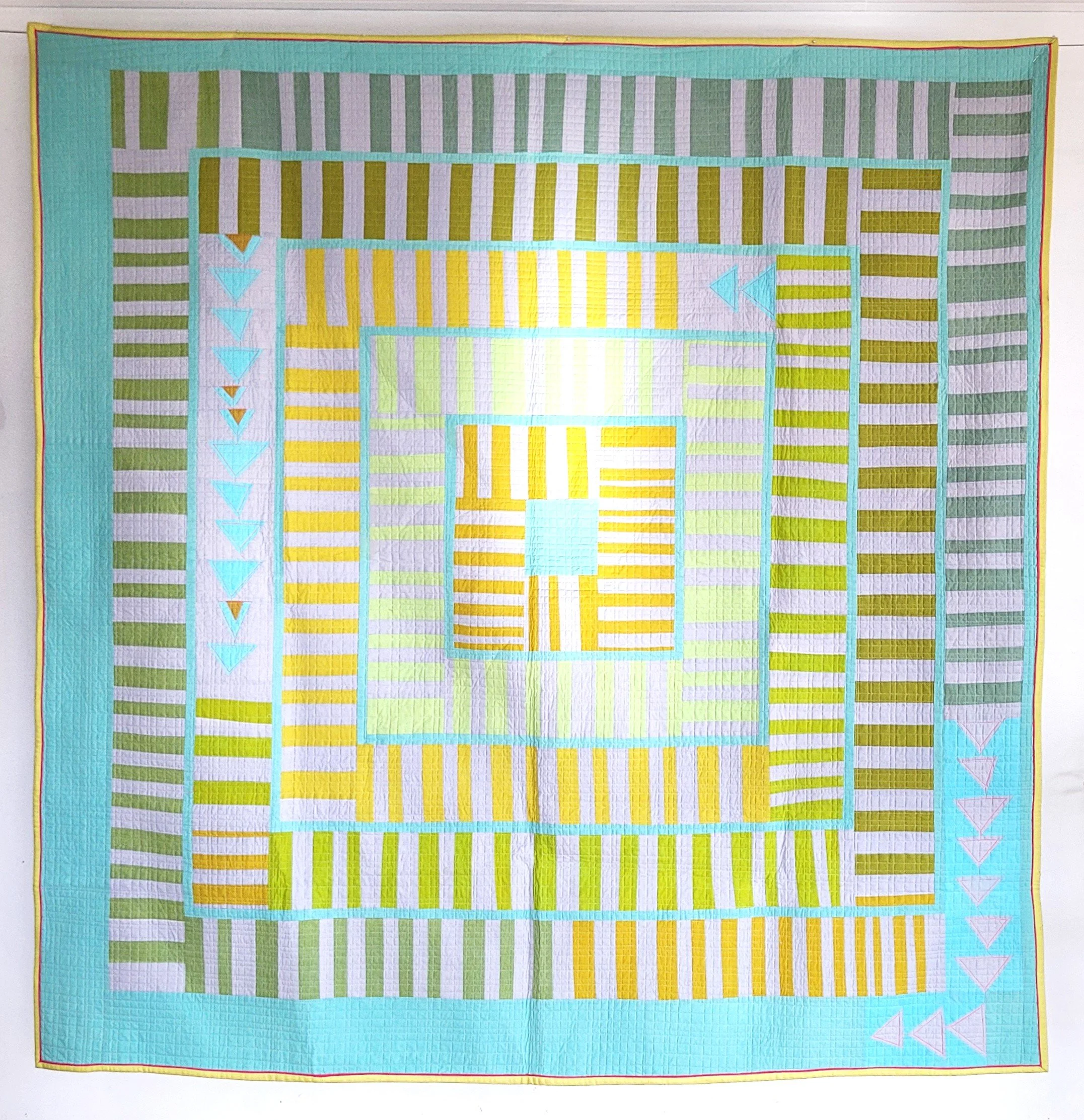 Hand Dyed Berry Jam made by Tia Curtis. I added some improv flying geese to this version to add some fun to the quilt.