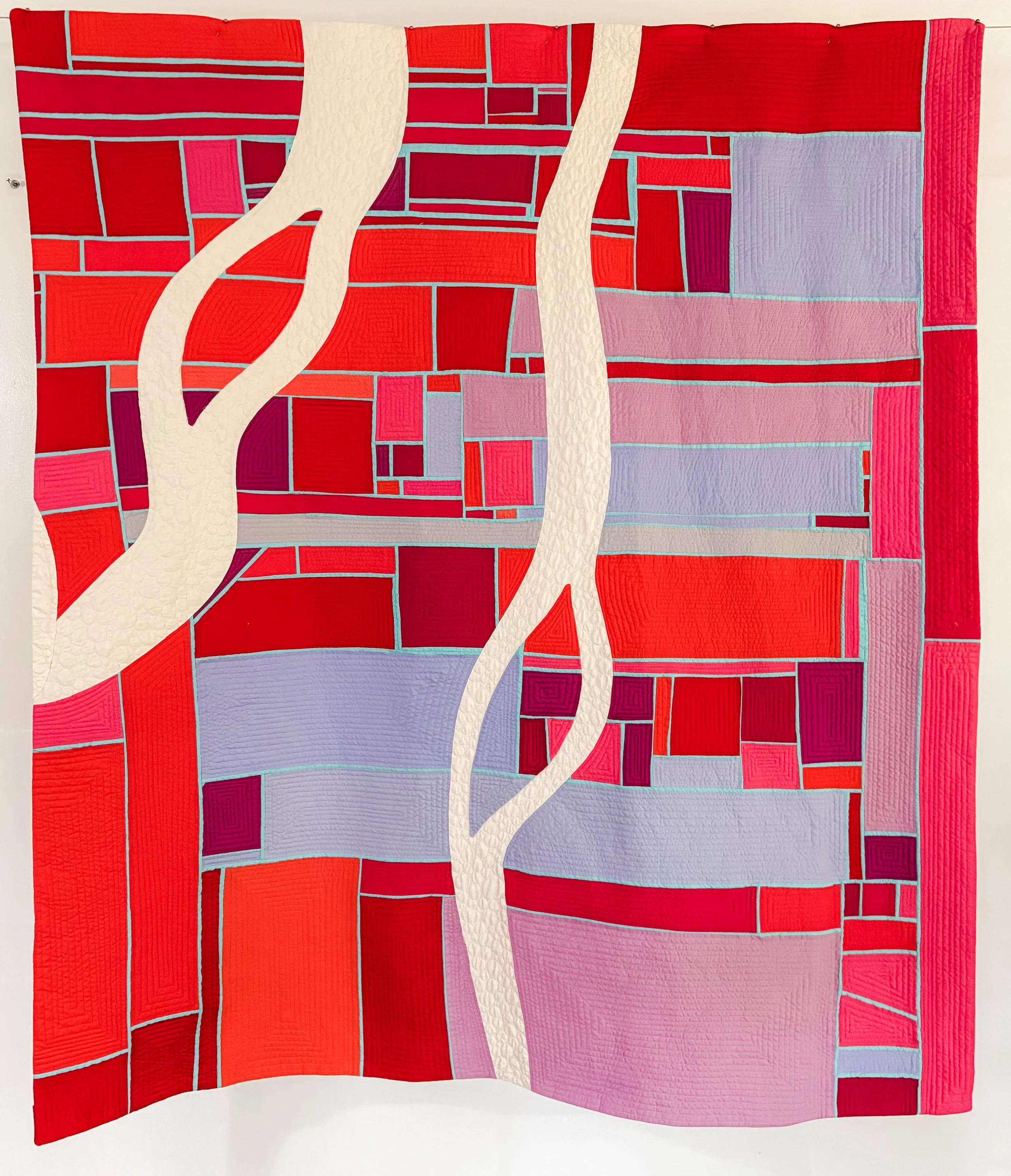 Creative Flow by Tia Curtis. I had fun experimenting with narrow inset strips then cut it up to insert waves of thought. I love when I get to loose time in creative flow and this is a bit what it feels like to me. I custom quilted in on my longarm.