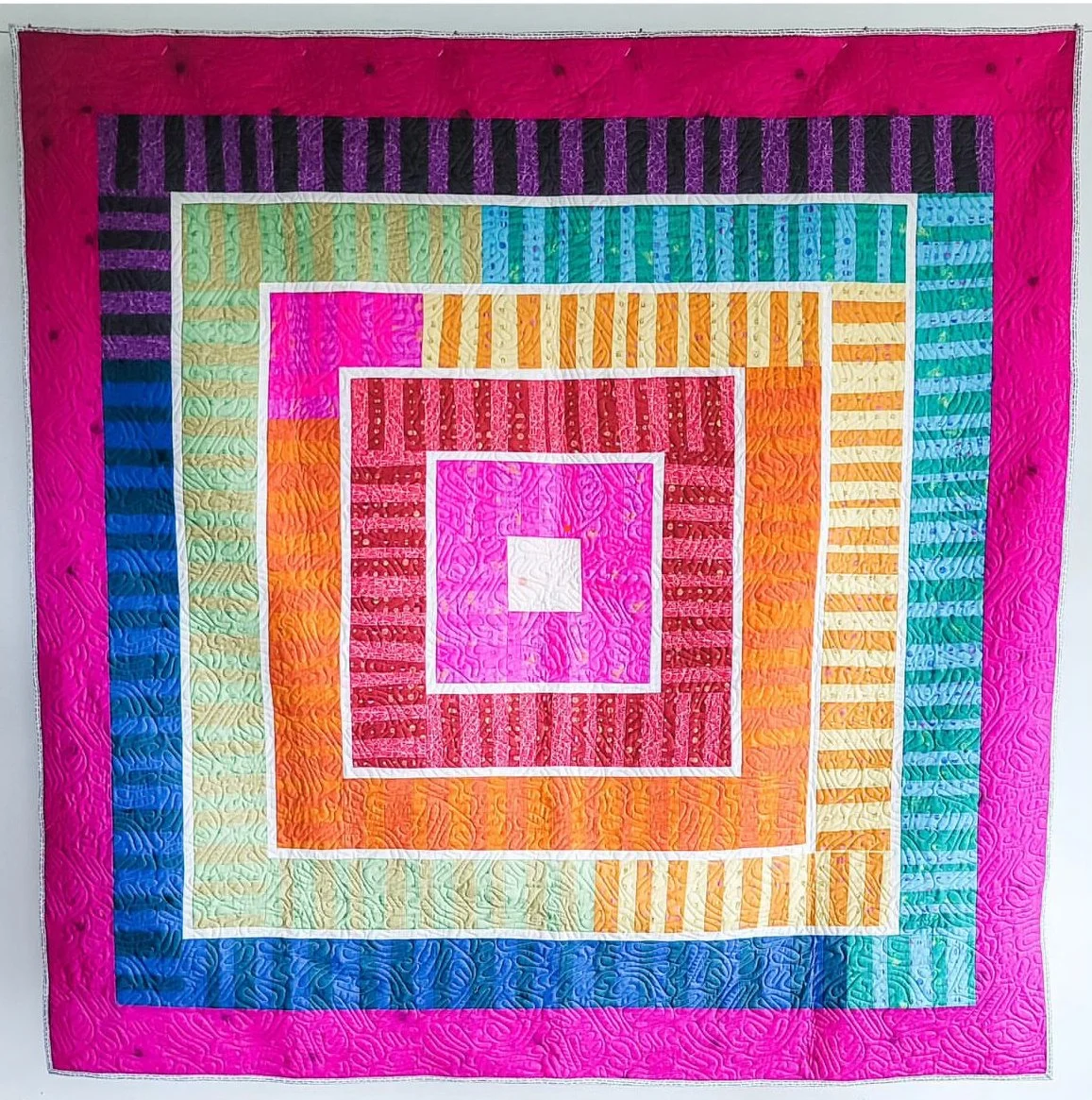 Soliloquy Berry Jam Quilt made by Tia Curtis out of Alison Glass Soliloquy fabric.