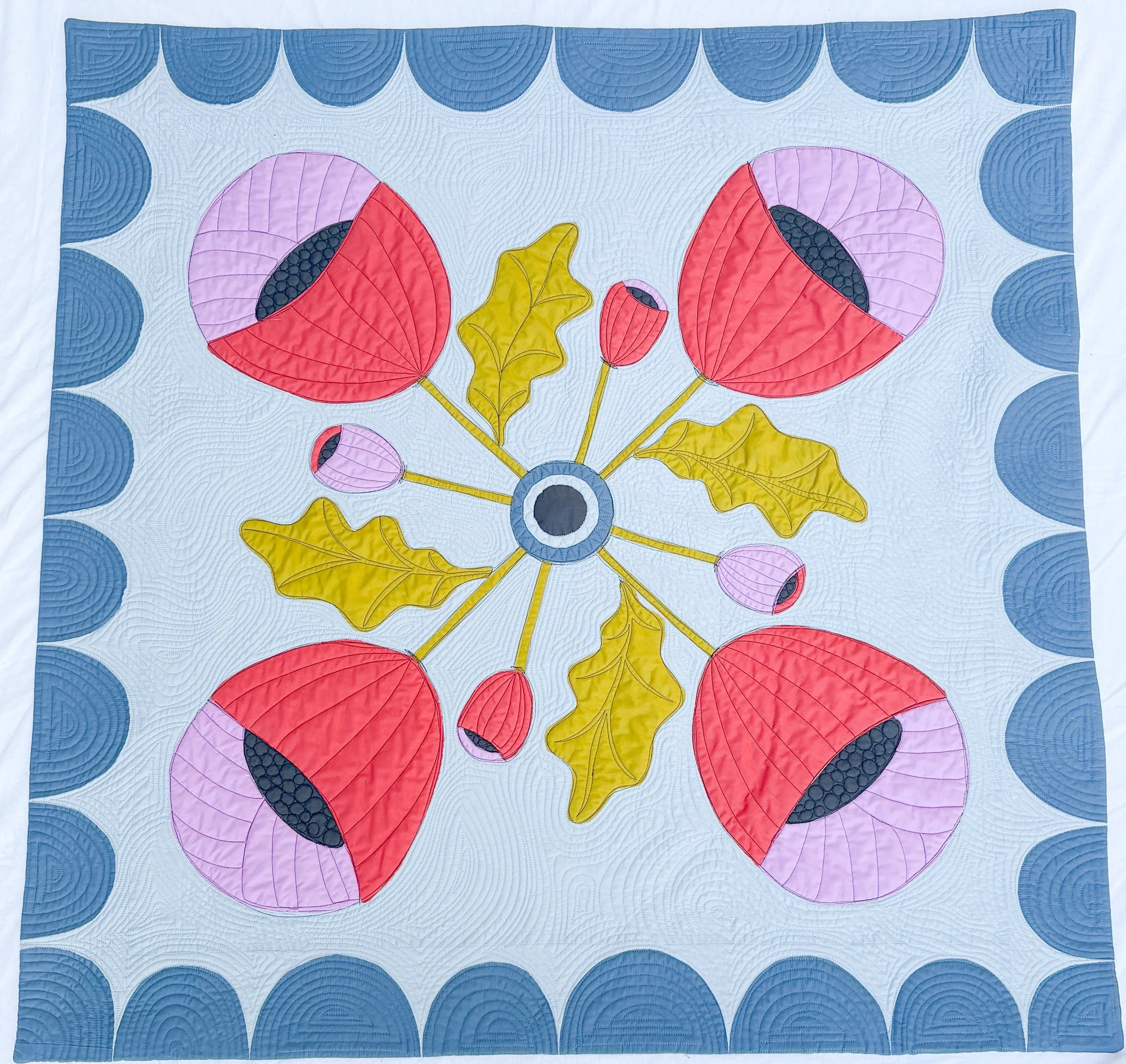 Ben's Poppies made by Tia Curtis. This small quilt is a continuation in my obsession with traditional 4 block applique quilt blocks. It was custom quilted on my longarm