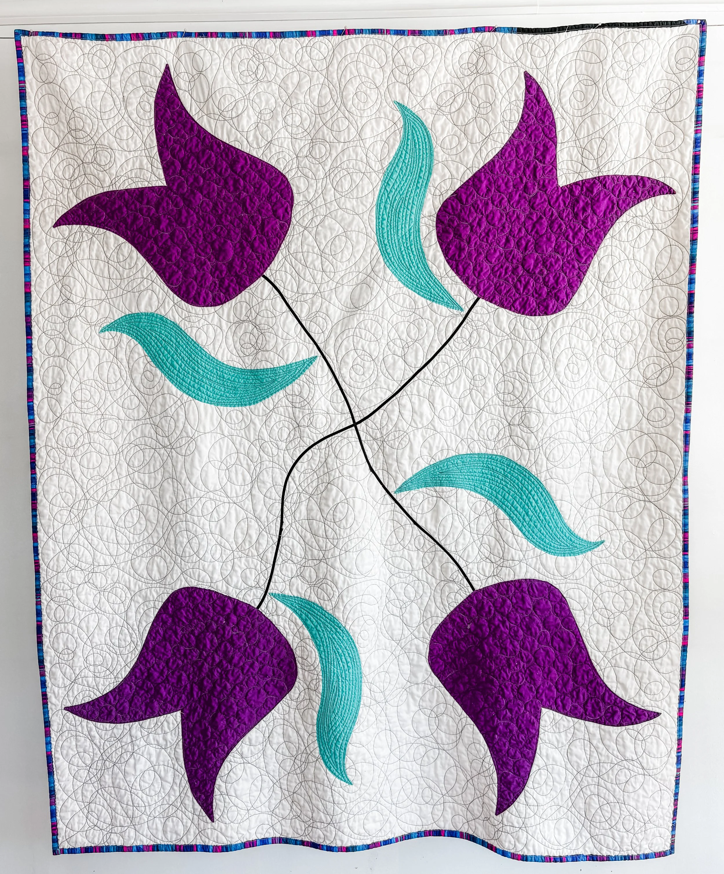 Big Tulips By Tia Curtis. This quilt was an experiment in large scale applique. It is twin sized