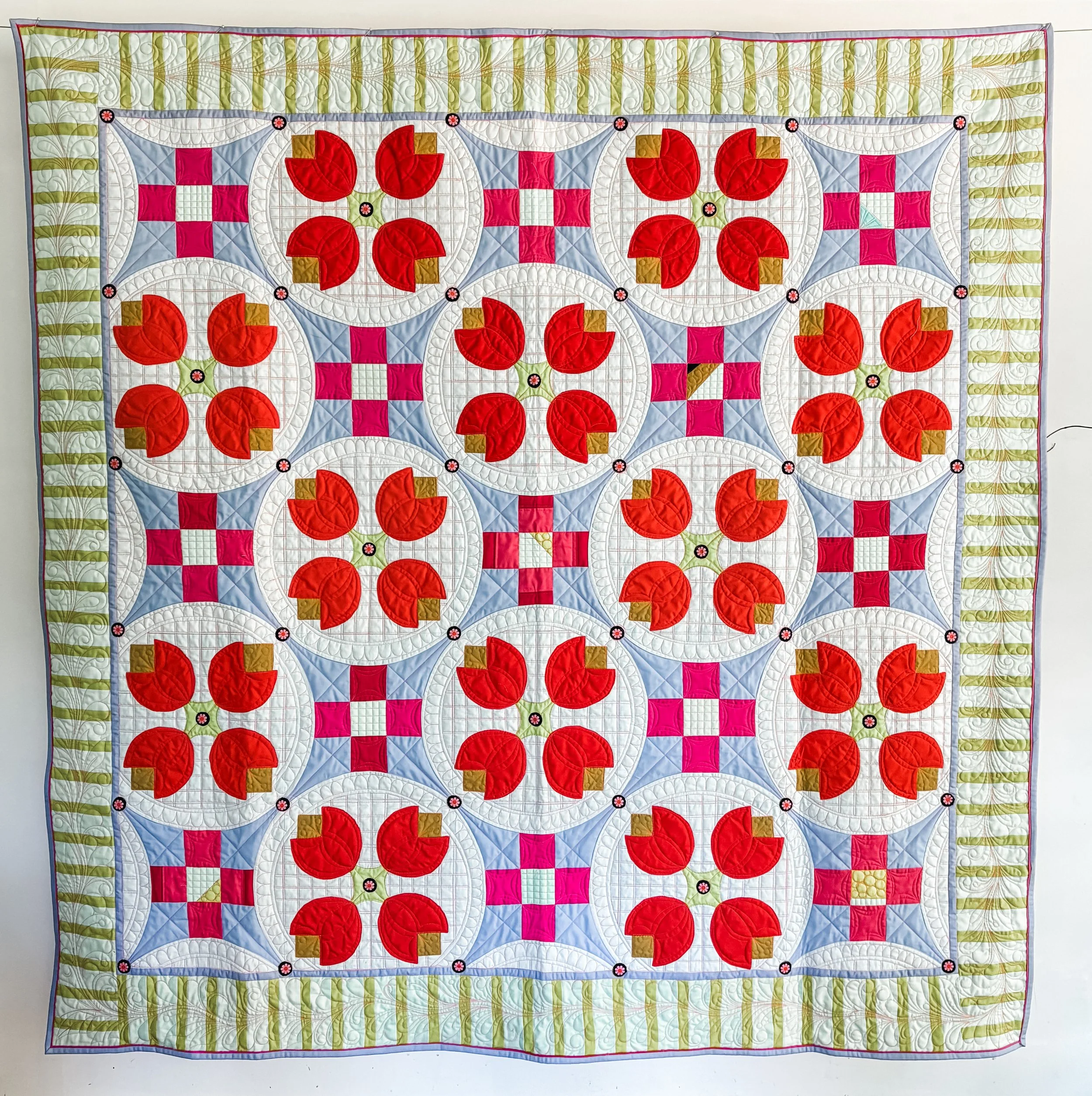 Tia's Tulips #3 I love these unexpected color combinations. I custom quilted it on my long arm and it will be a pattern soon