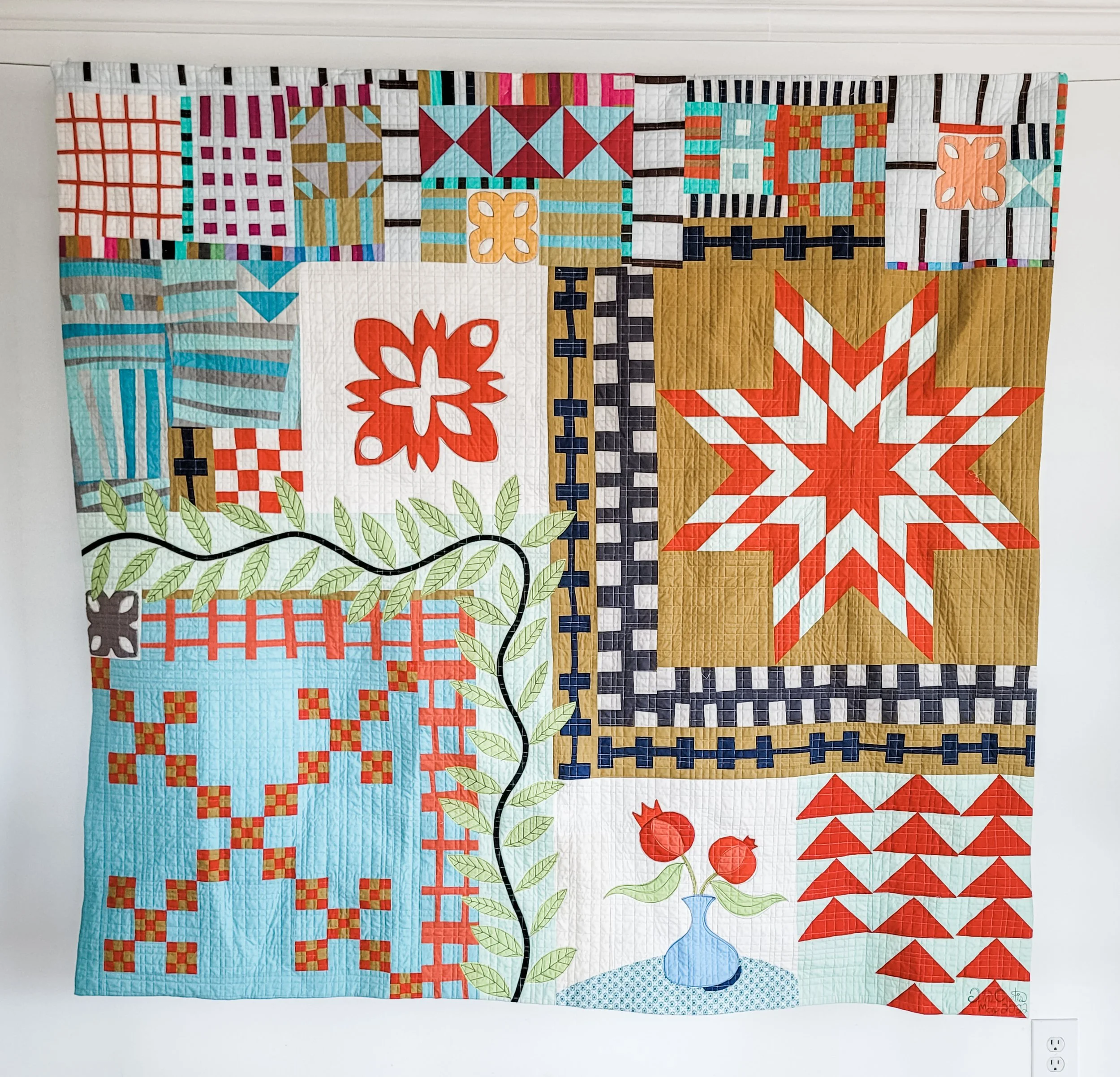 Orphan Block quilt is solids made by Tia Curtis. This quilt was made with orphan blocks leftover from classes I taught and classes I took with various artists. I quilted it on my longarm.