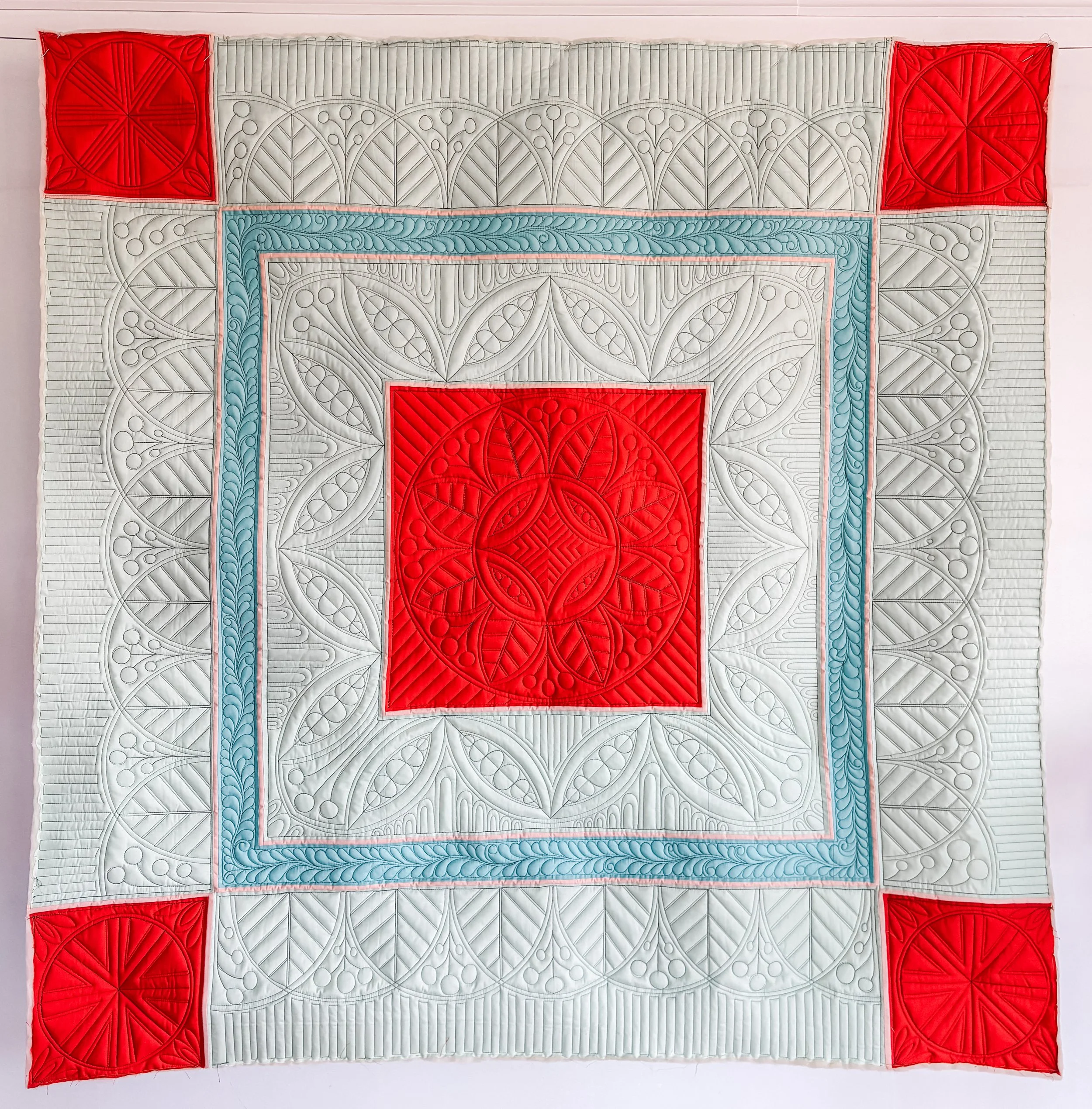 Welsh Quilting made by Tia Curtis. I am obsessed with Welsh quilting designs and needed an updated version for my Welsh Quilting class. I custom quilted it on my longarm with black thread.