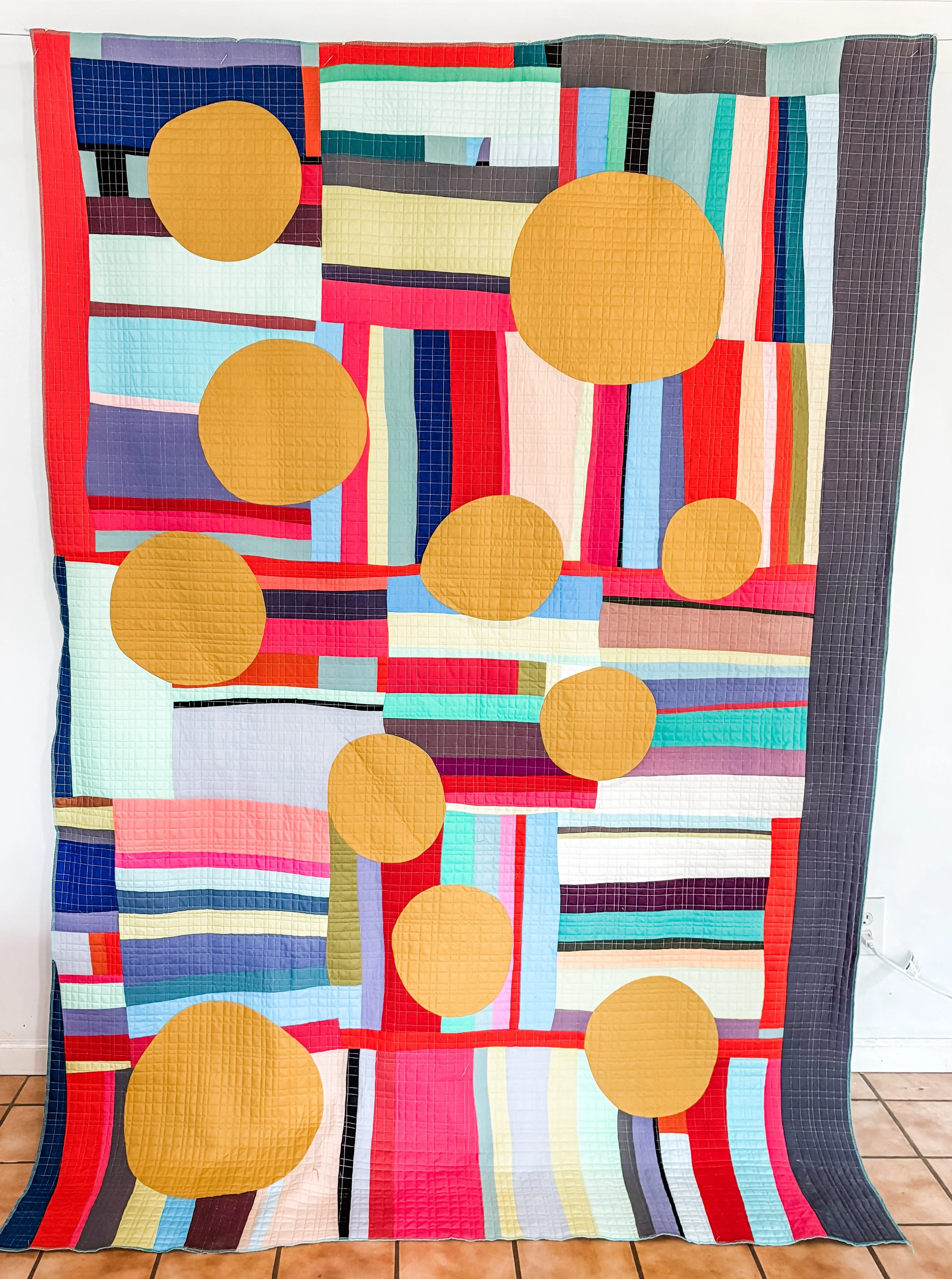 A different Stripe quilt made by Tia Curtis in a workshop with Dynse Schmidt. I inset some large circles into the quilt hoping to calm it down. I eventually cut it up and made it into a jacket.