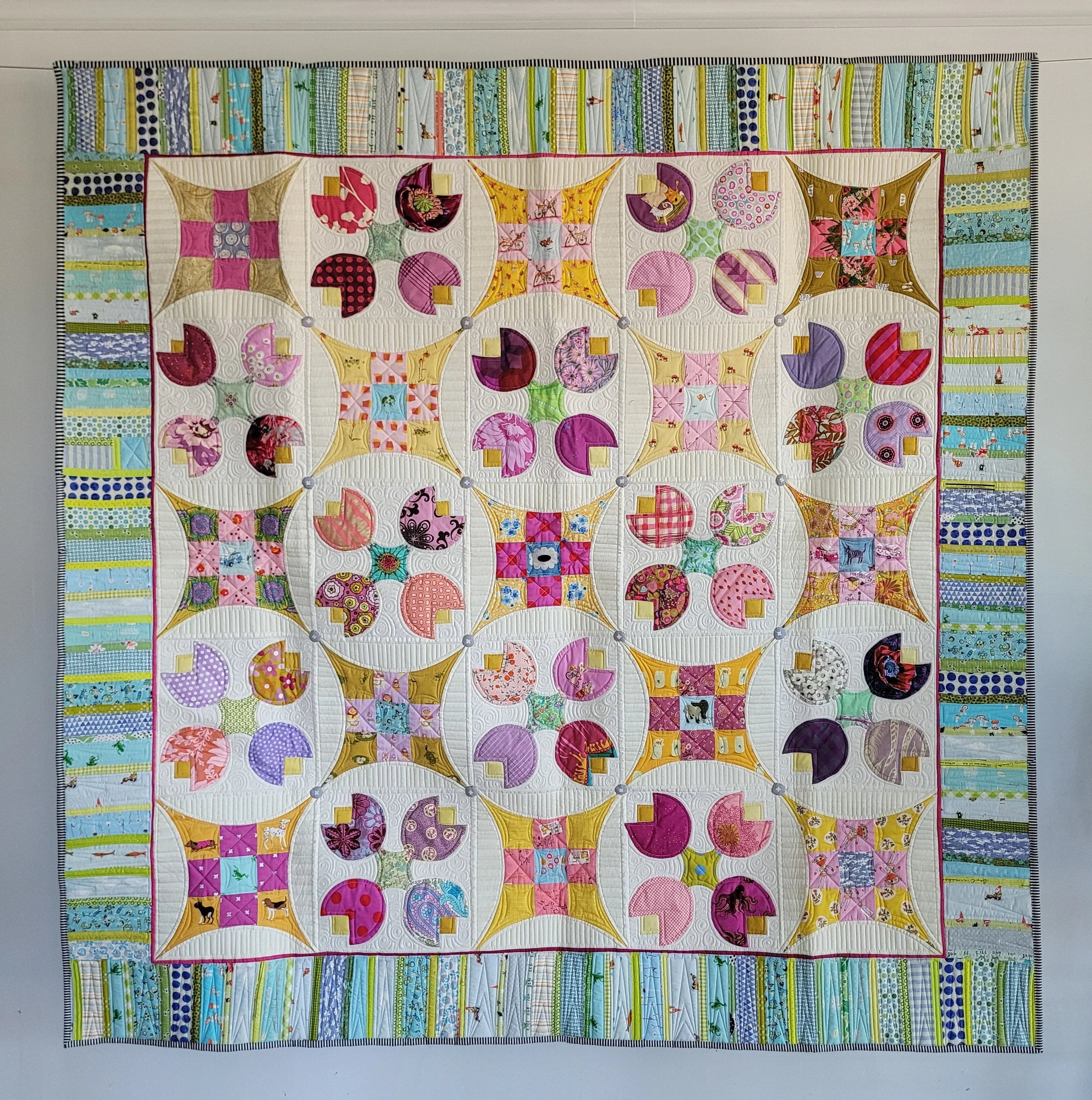 Tia's Tulips #1 made by Tia Curtis. I have always loved an improved 9 patch block and thought it would be fun to combine it with simple applique. This will be a quilt pattern by me soon.