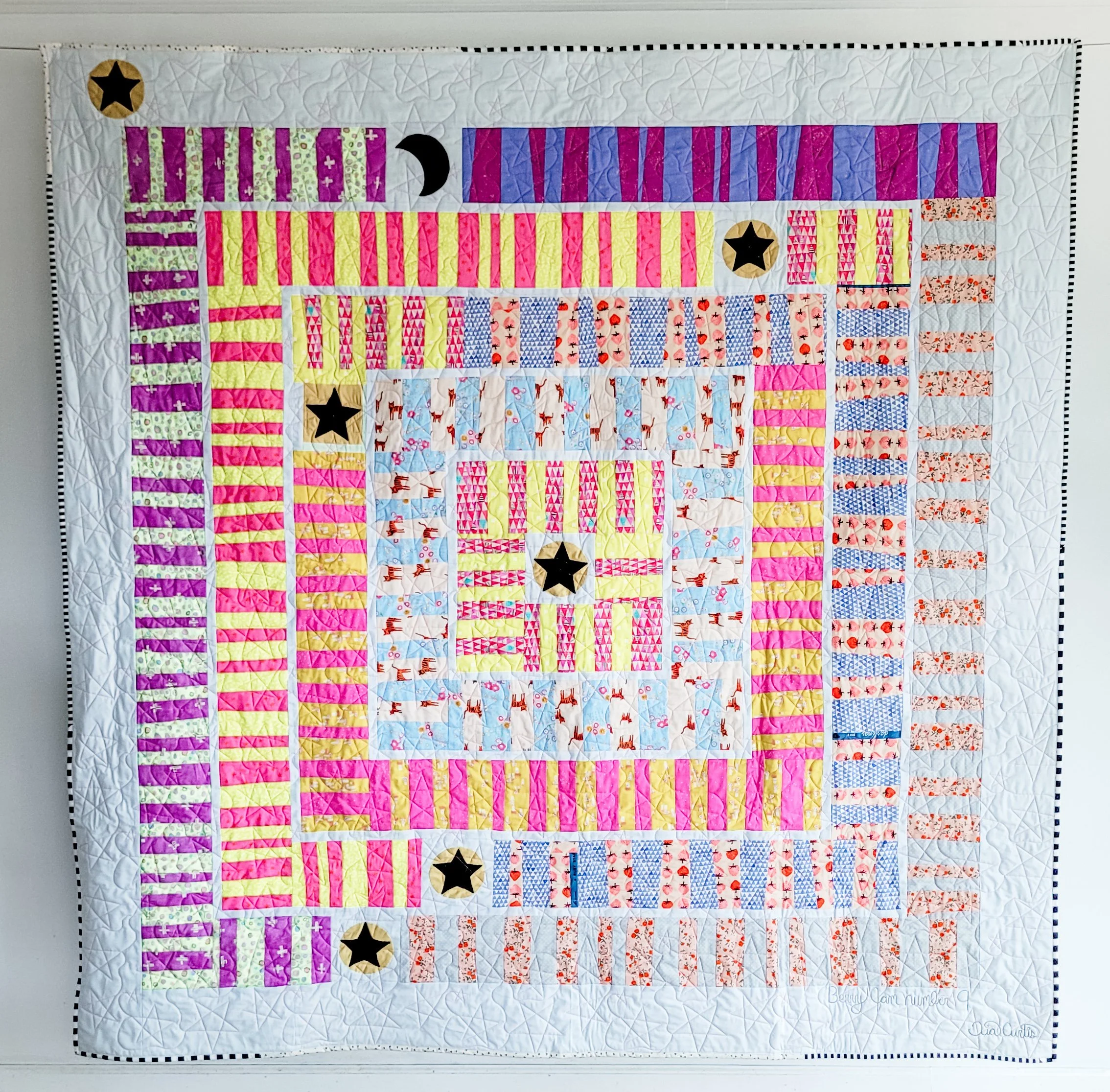 Favorite prints Berry Jam Quilt made by Tia Curtis. I added some applique blocks to this version.