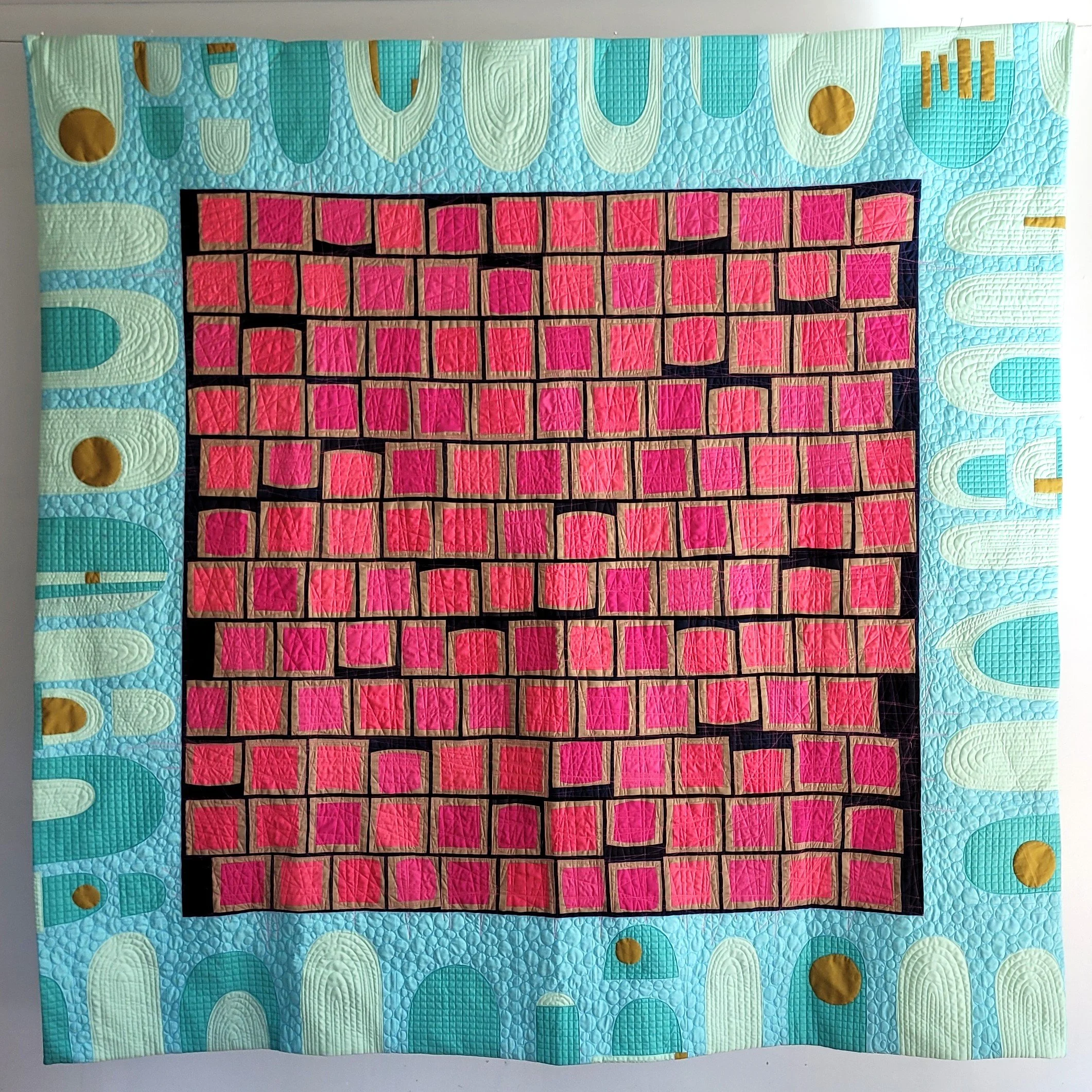Ideas in the Pool by Tia Curtis. I swim laps most mornings and my mind has time to wonder. I custom quilted this quilt on my longarm.