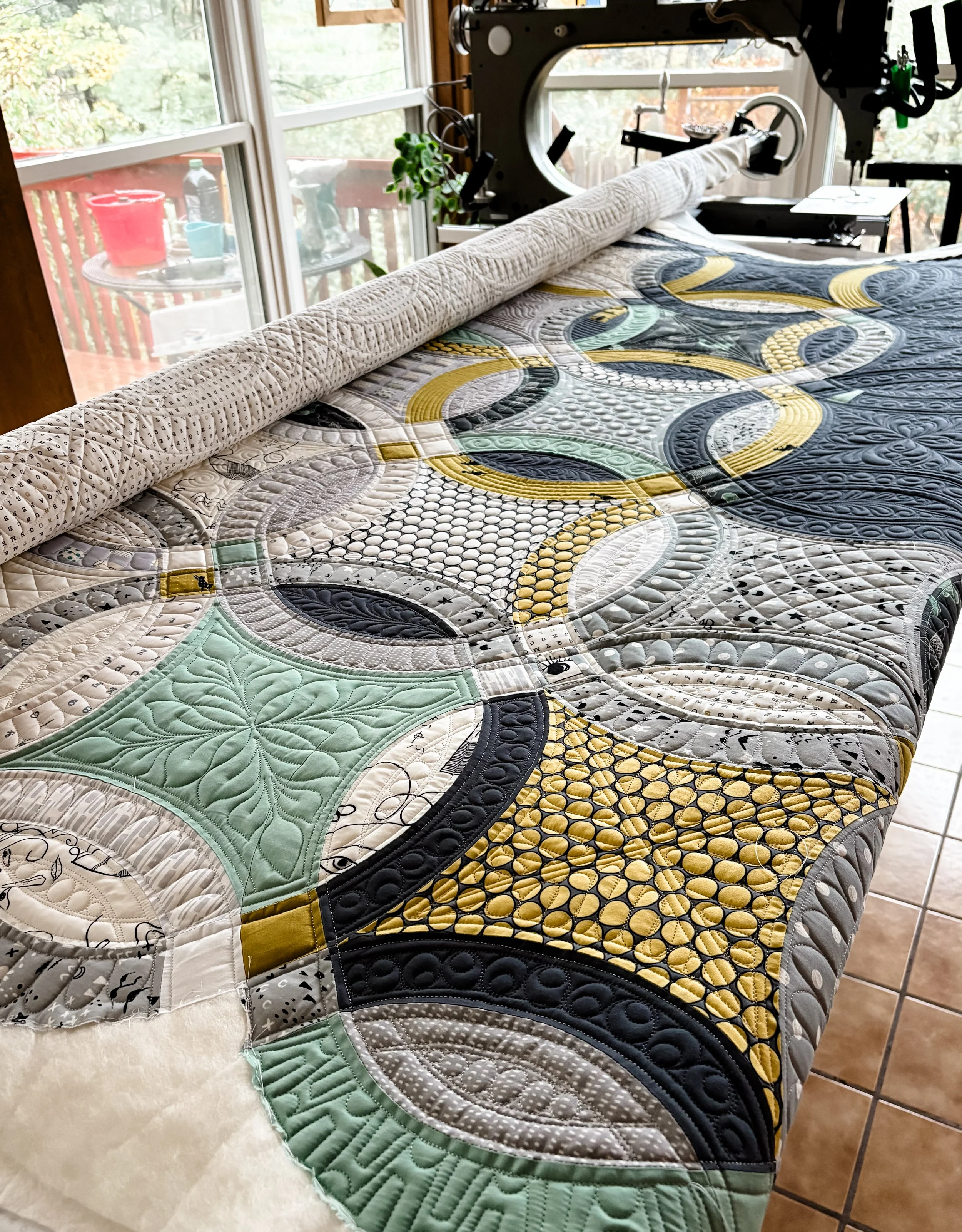 Metro Rings Quilt made by Julie. I custom Quilted it