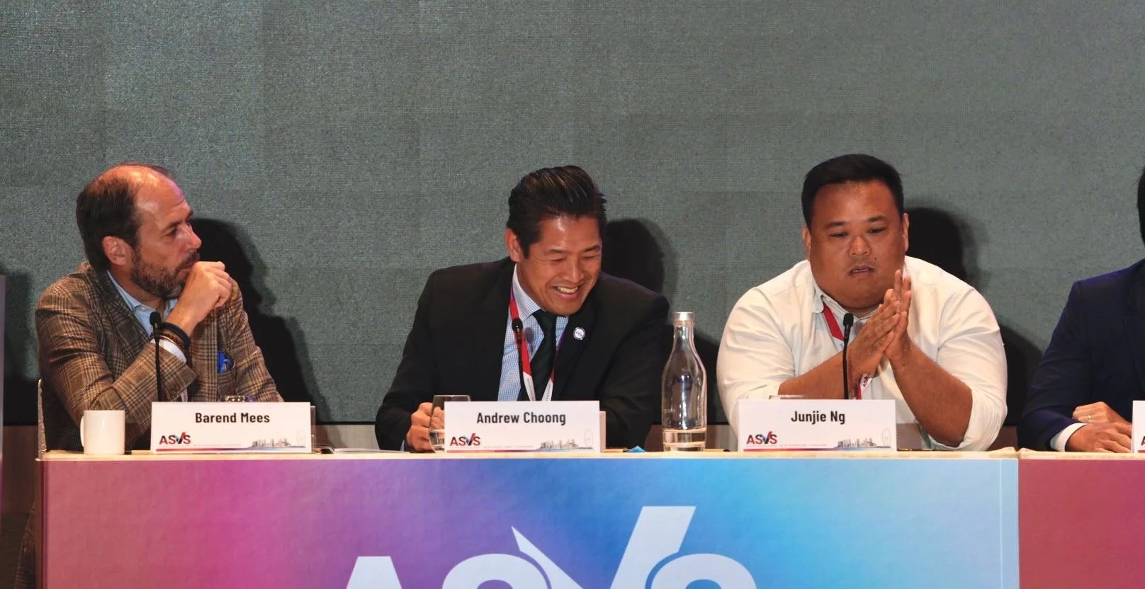 Dr Andrew Choong seated with fellow speakers on an ASVS 2025 conference panel in Singapore
