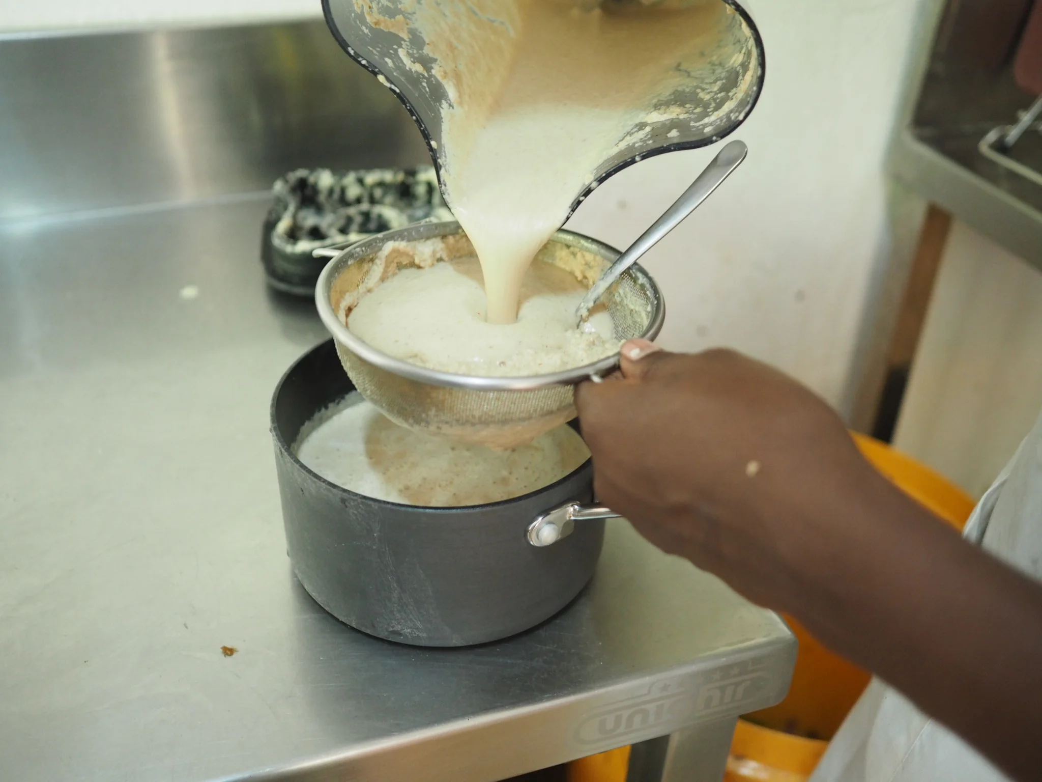 Making nut milk with the local cashews