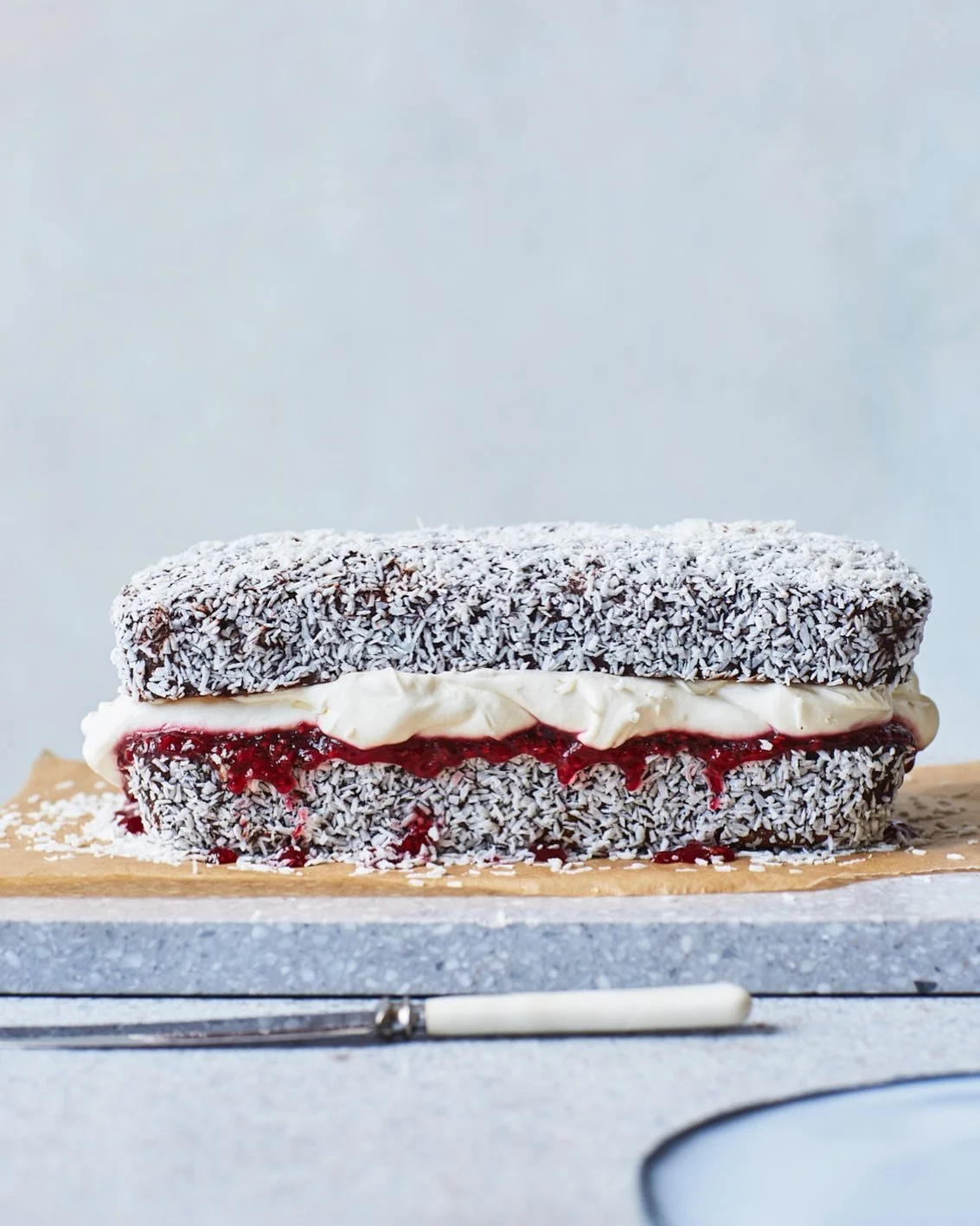 @bakingtheliberty&rsquo;s genius Lamington Loaf from her new book &lsquo;I&rsquo;ll Bake&rsquo;. Any cake which is predominantly a vehicle for eating a lot of softly whipped cream is a winner in my book.

Photography 📷: @lizziemayson 
Props 🍽️: @lo