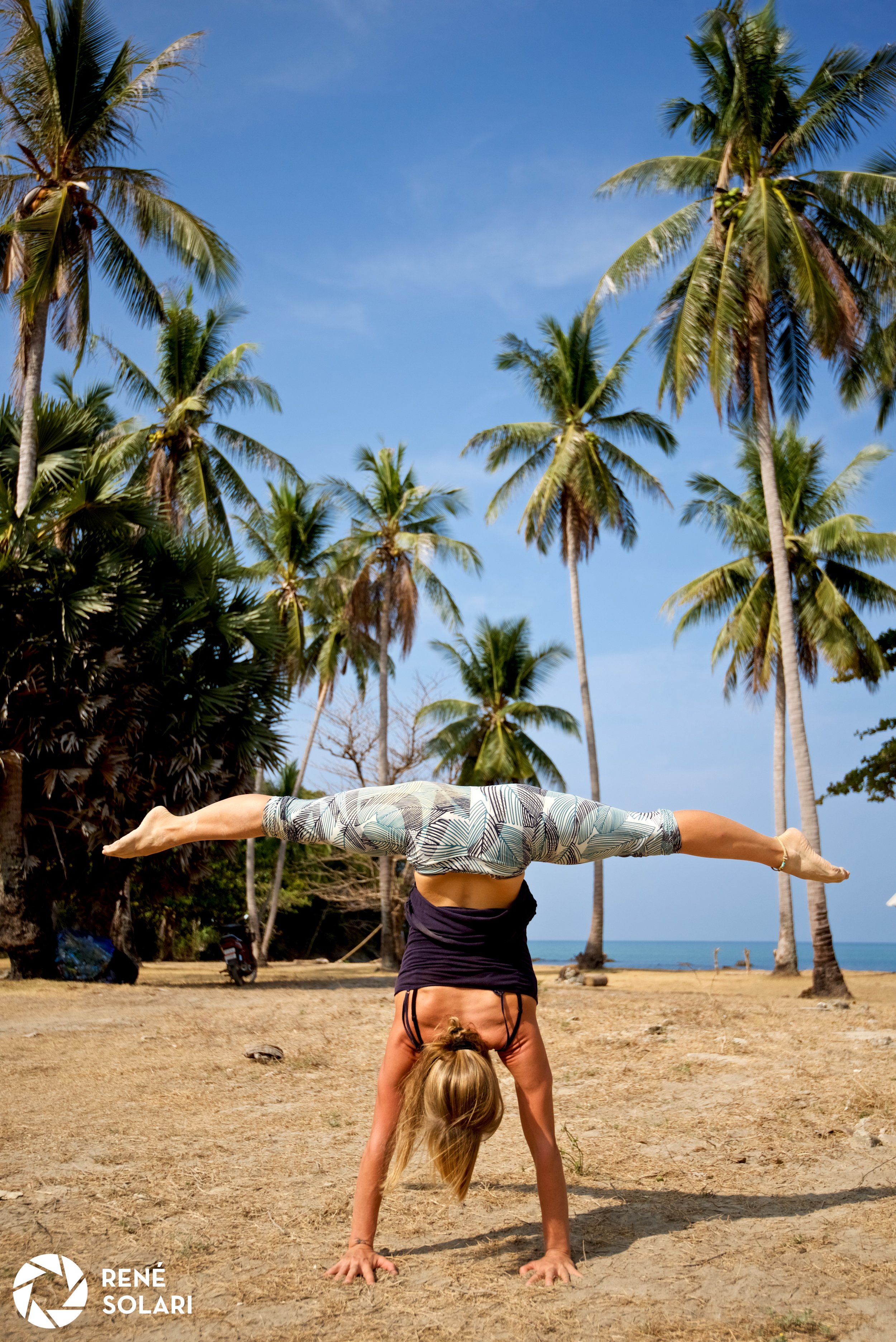 Renee Split handstand beach.jpg